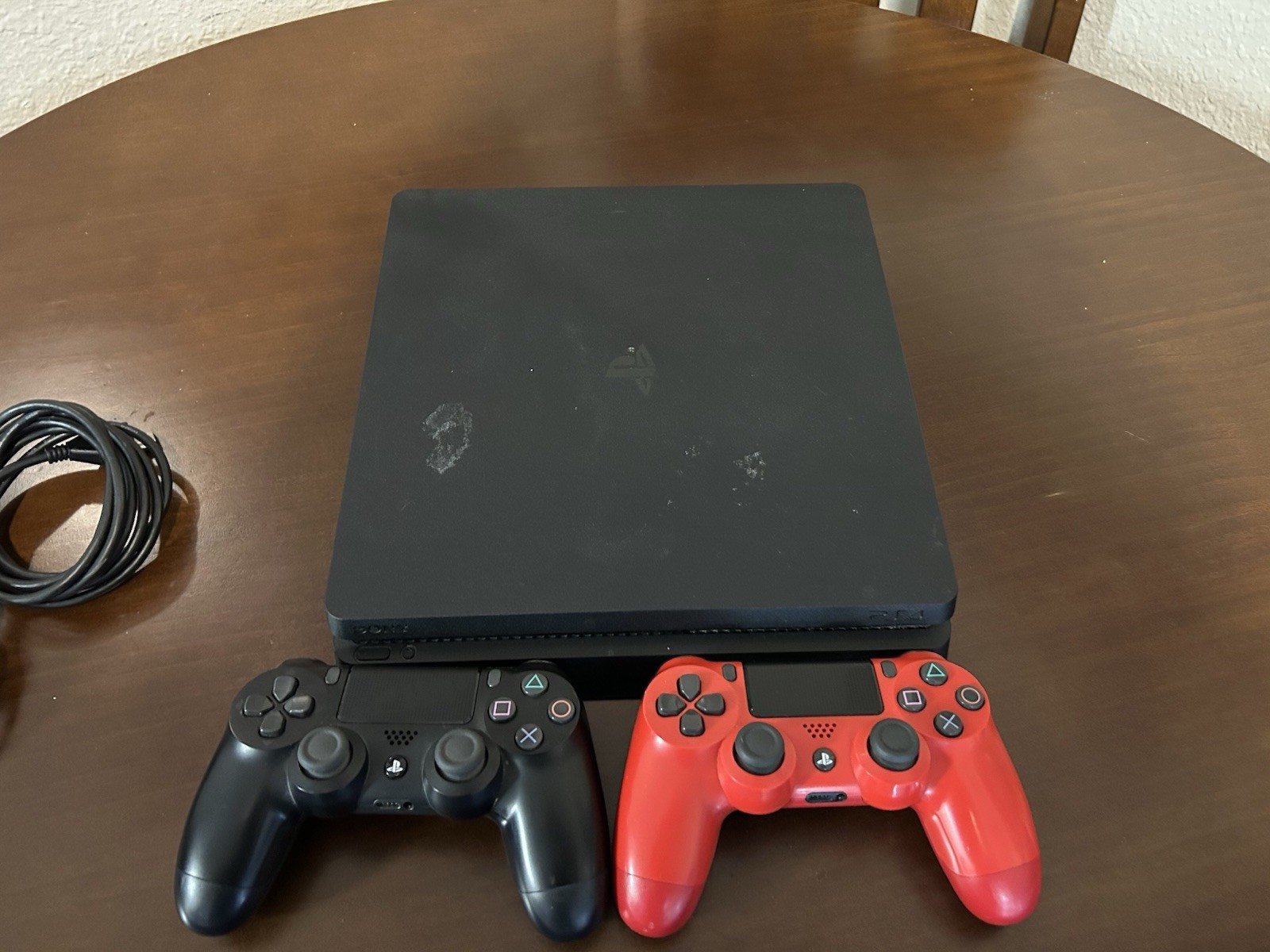 PS4 Slim 1TB Console W/ 2 Controllers, 4 Games