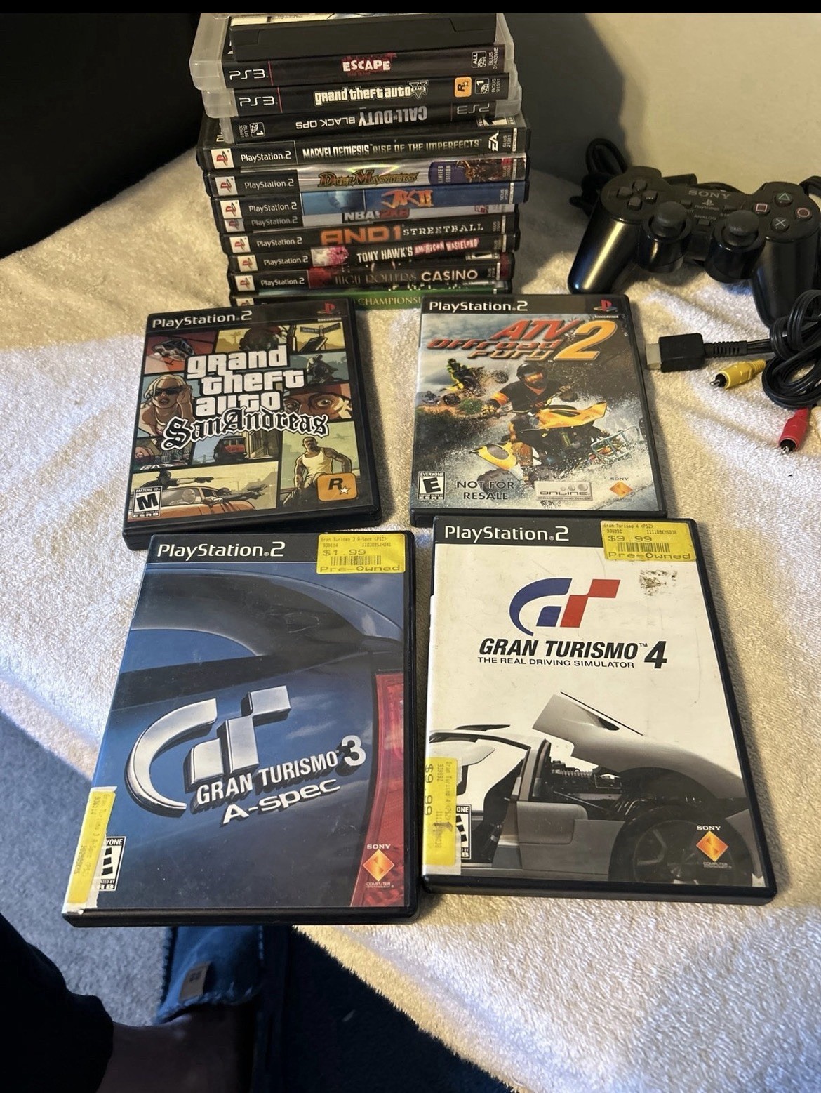 PlayStation 1, 2, & 3 Game lot. 19 total games & PS2 wired controller. Used