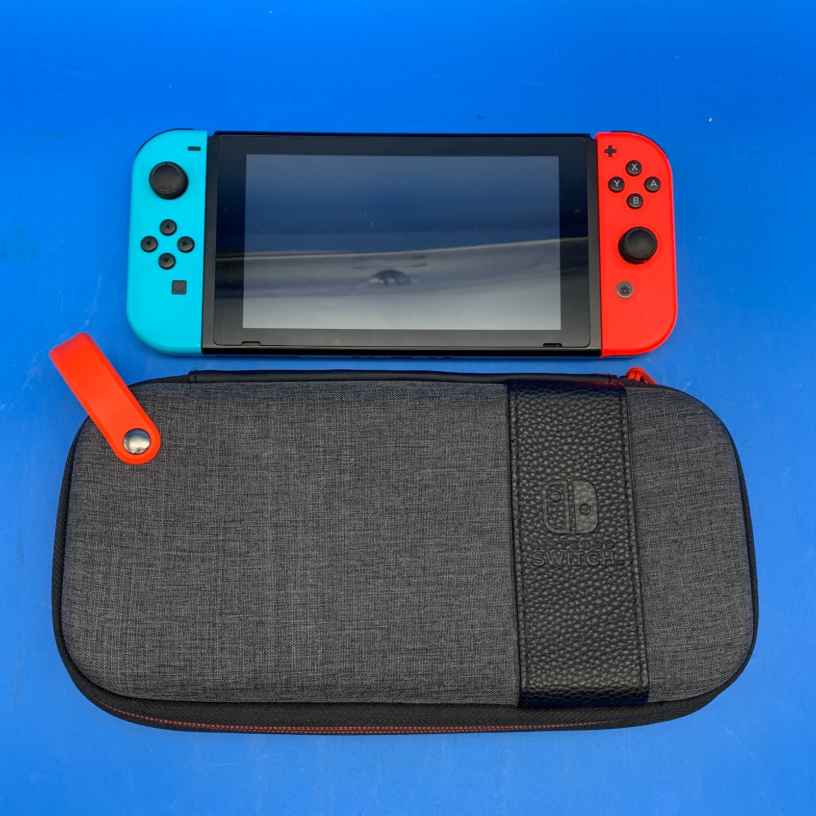 Nintendo Switch HAC-001(-01) 32GB Handheld Console w/ Red/Blue Joy-Cons + Case