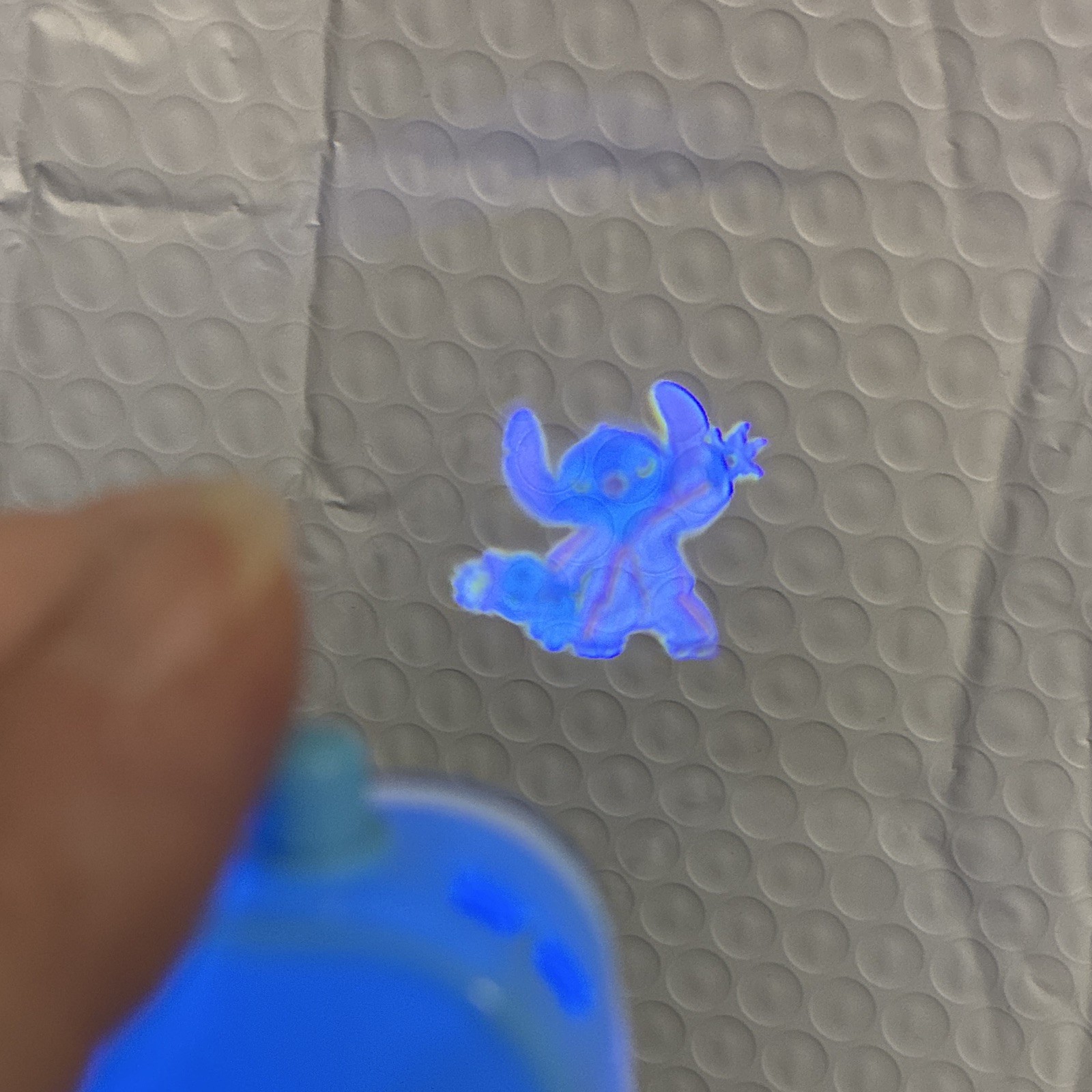 Disney Stitch Keychain – new one in bag/each click shows a new image on wall