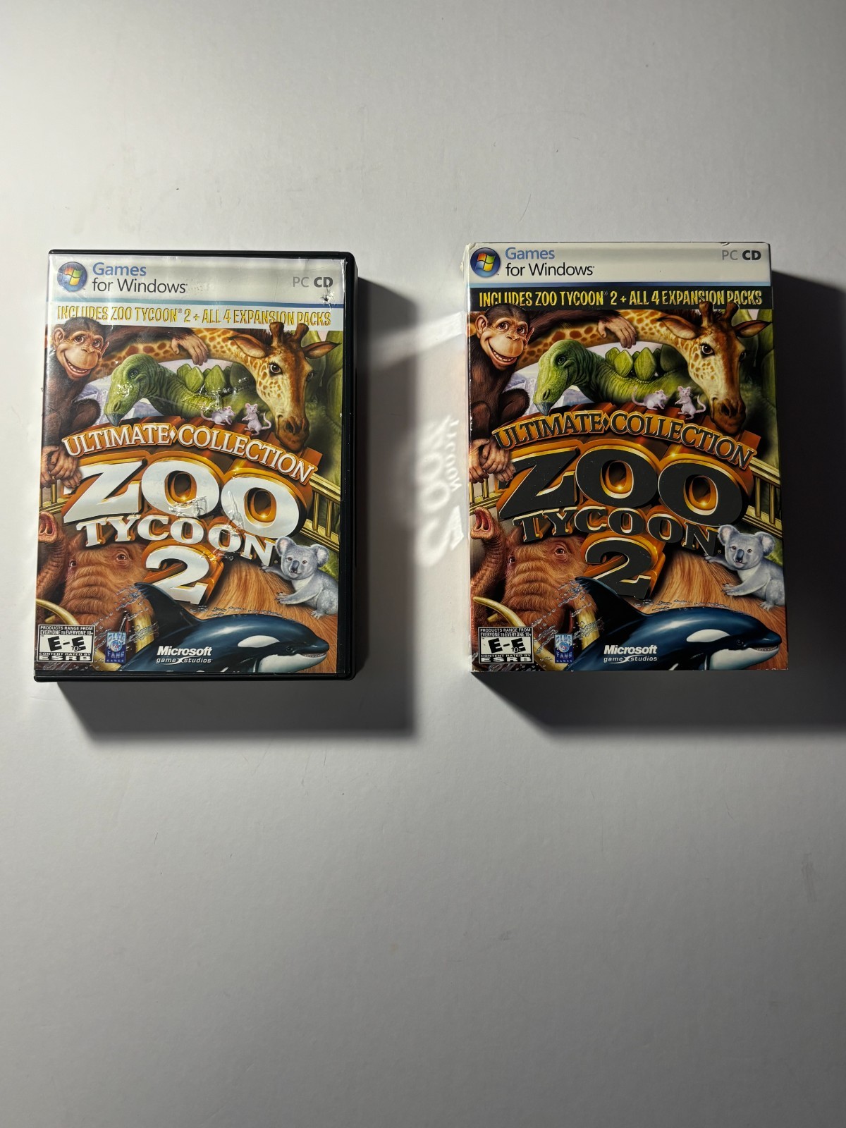 Lot of Zoo Tycoon games and pen
