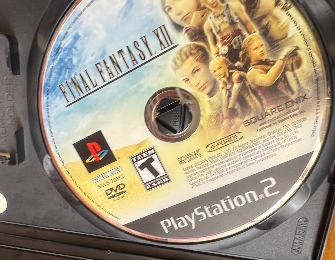 Square Enix Final Fantasy XII 2006 Teen Version Sony PlayStation W/ Book