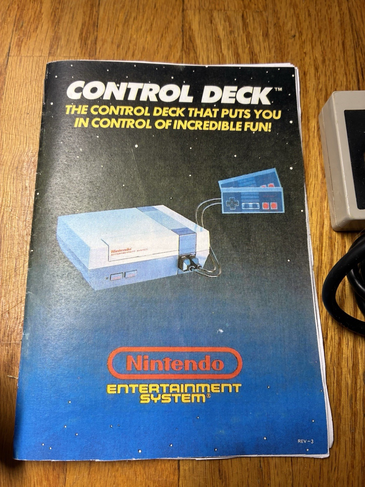 2 Vintage Nintendo NES OEM Controllers, RF Adapter, And Manual.