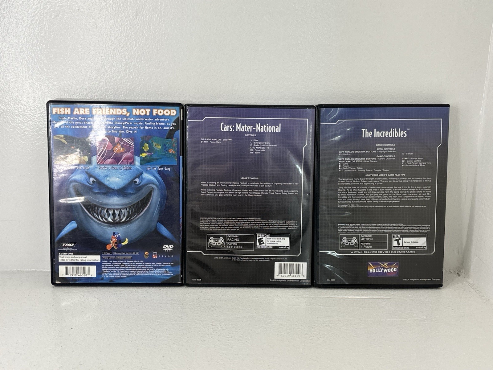 Disney PlayStation 2 Game Lot Finding Nemo, Cars Mater National, The Incredibles