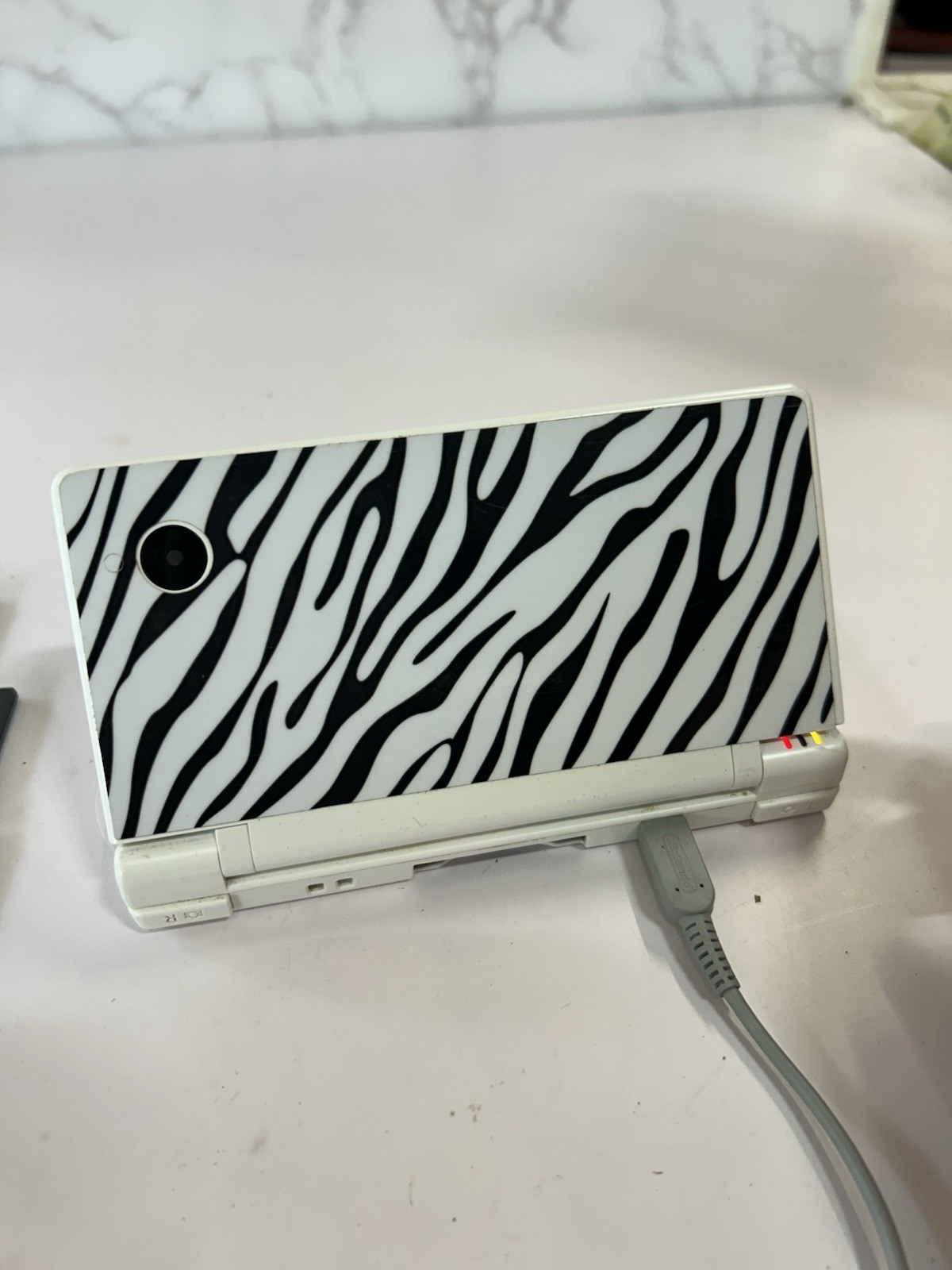 Nintendo DSi White With Print Cover Handheld System with 7 Games