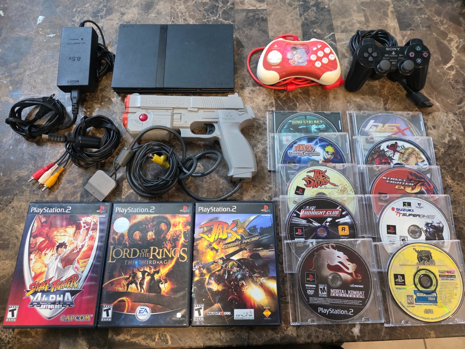 PS2 Slim Console + 13 games+Guncon+ SF Controller + Xmen vs Street Fighter etc.
