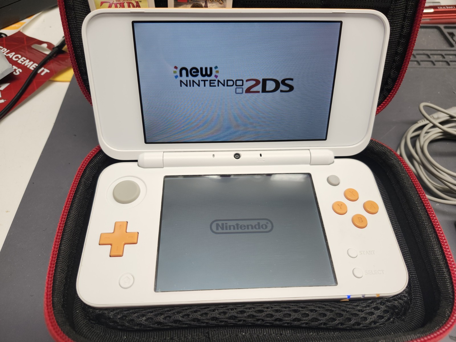 Nintendo 2DS XL Console w/ 6 games. Zelda, Starfox, LOTR & more. White & Orange