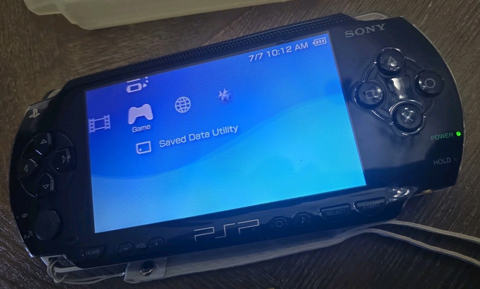 Sony PSP-1001 Black Handheld System, Charger, Memory Cards, And Cases. Read !!