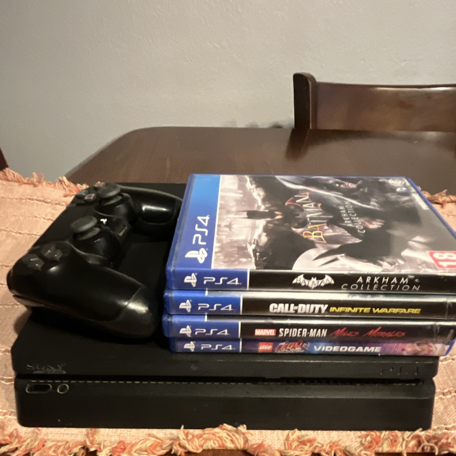 Sony PlayStation 4 Slim Console + DualShock 4 Controller, 4 Games and cables