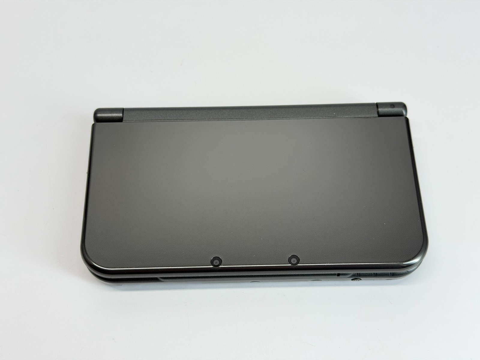 Nintendo New 3DS XL Metallic Black Handheld System *Screen has Yellow Line*