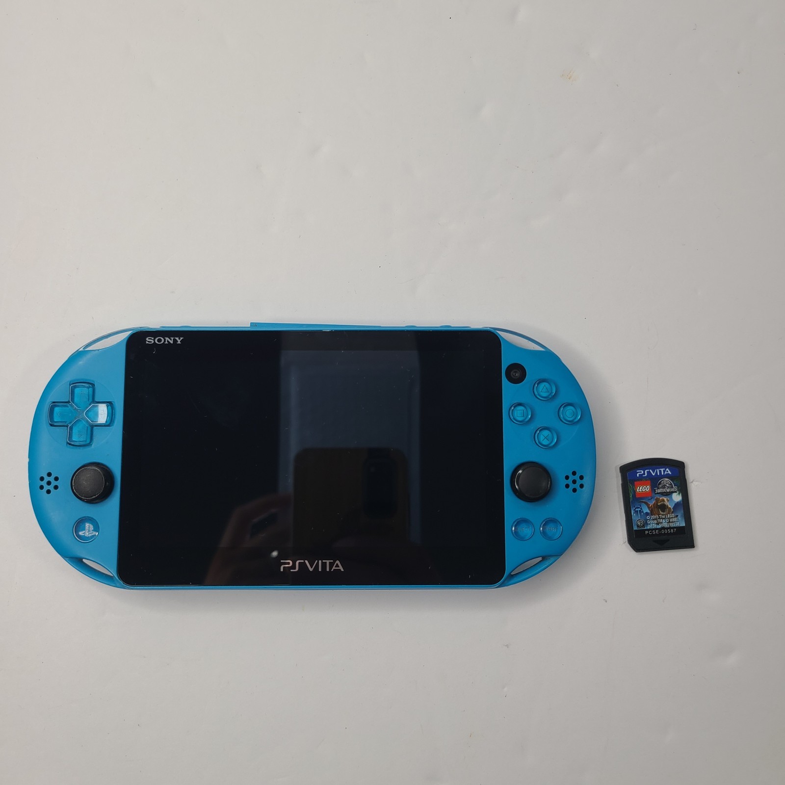 Sony PS Vita PCH 2000 ZA23 Aqua Blue Slim Console W/ LEGO Jurassic World Game