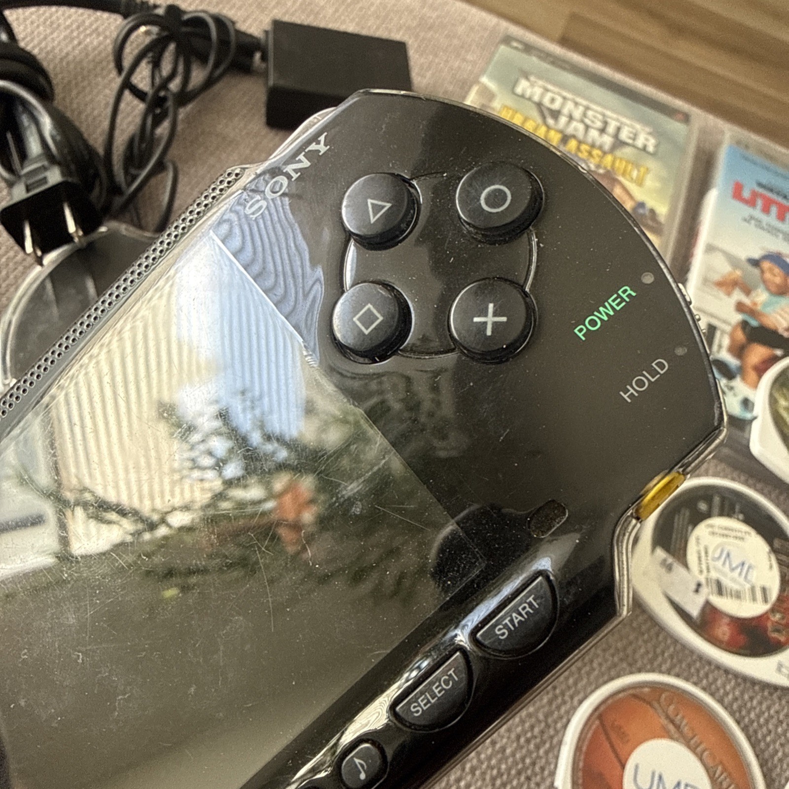 Sony PSP-1001 Black Console With Charger, 1GB Card , 11 Movies 2 Games & Case