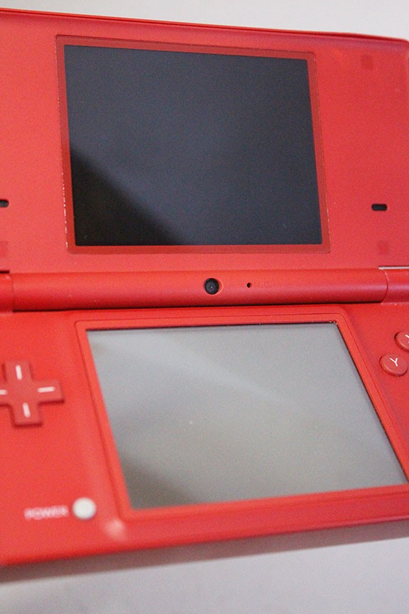 Nintendo DSi Red Handheld Game Console w/ Mario Skin Cover + Super Mario DS Game