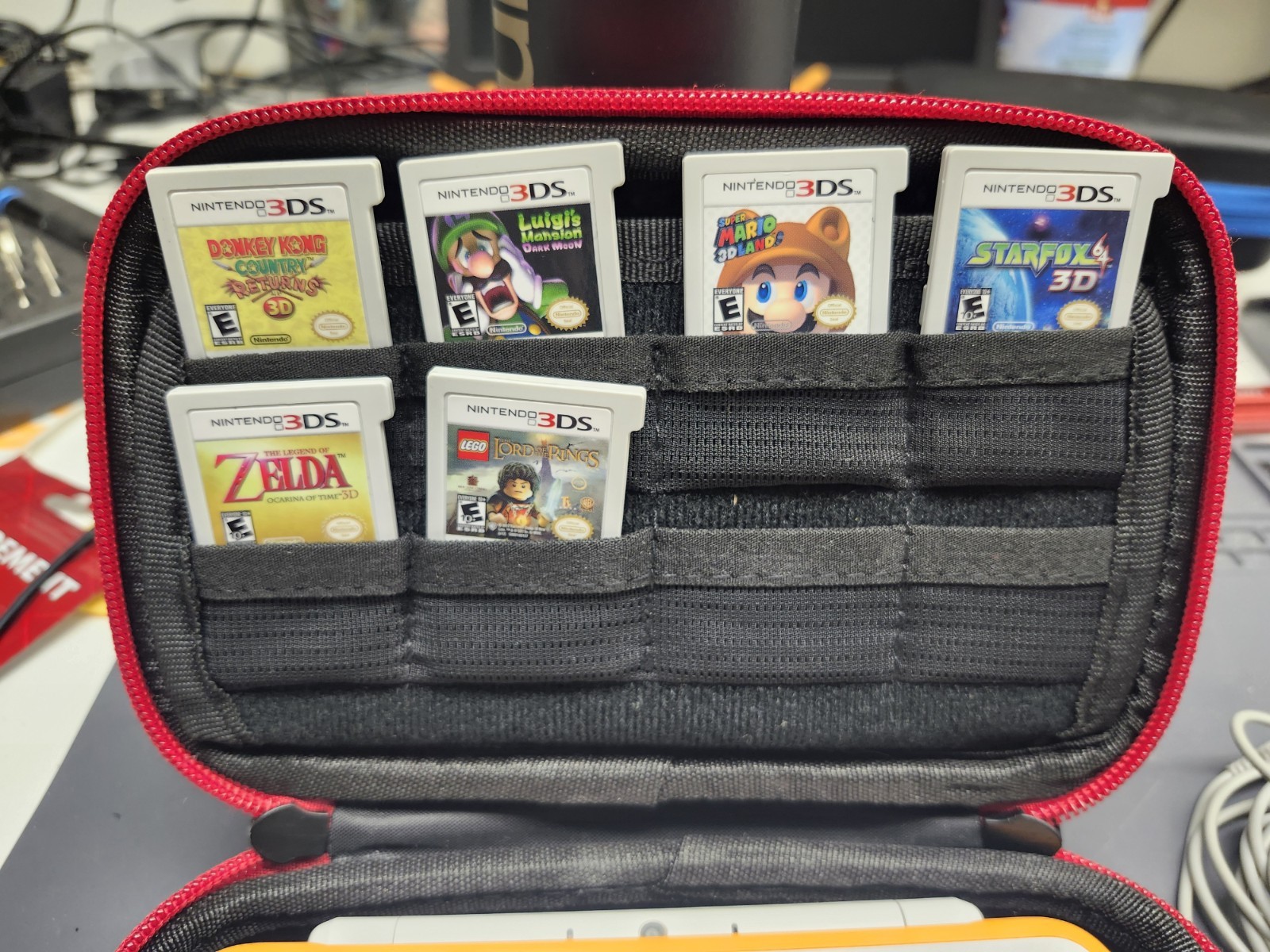 Nintendo 2DS XL Console w/ 6 games. Zelda, Starfox, LOTR & more. White & Orange