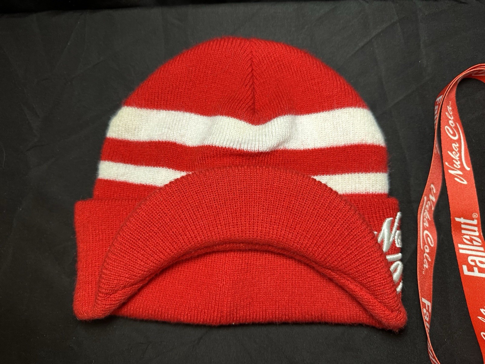 Lot of Bethesda Fallout Nuka Cola Bottle Caps, Beanie Hat, Lanyard & Keychain