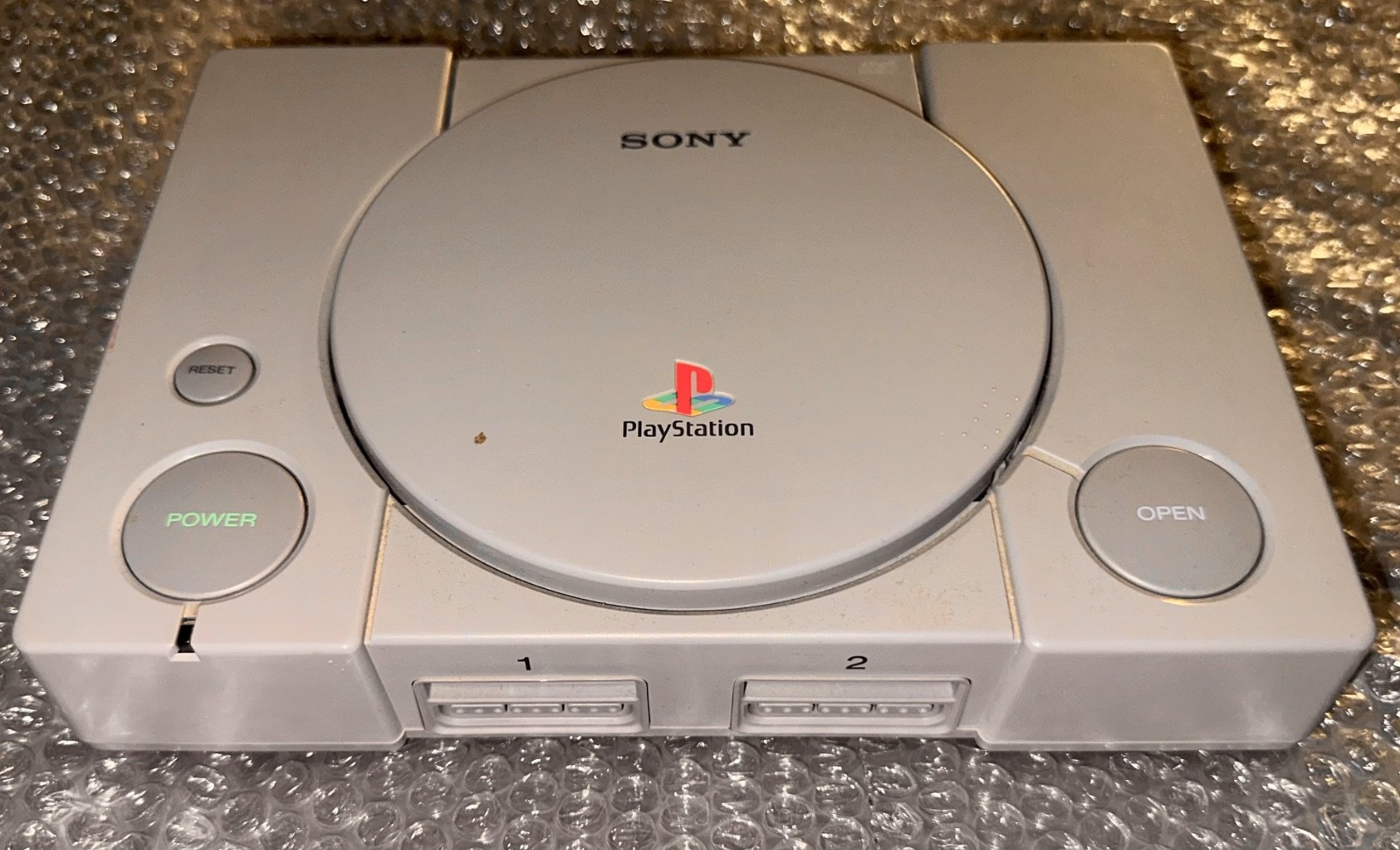 Sony PlayStation 1 Console (Gray), two Compatible Controllers, four PS1 Games