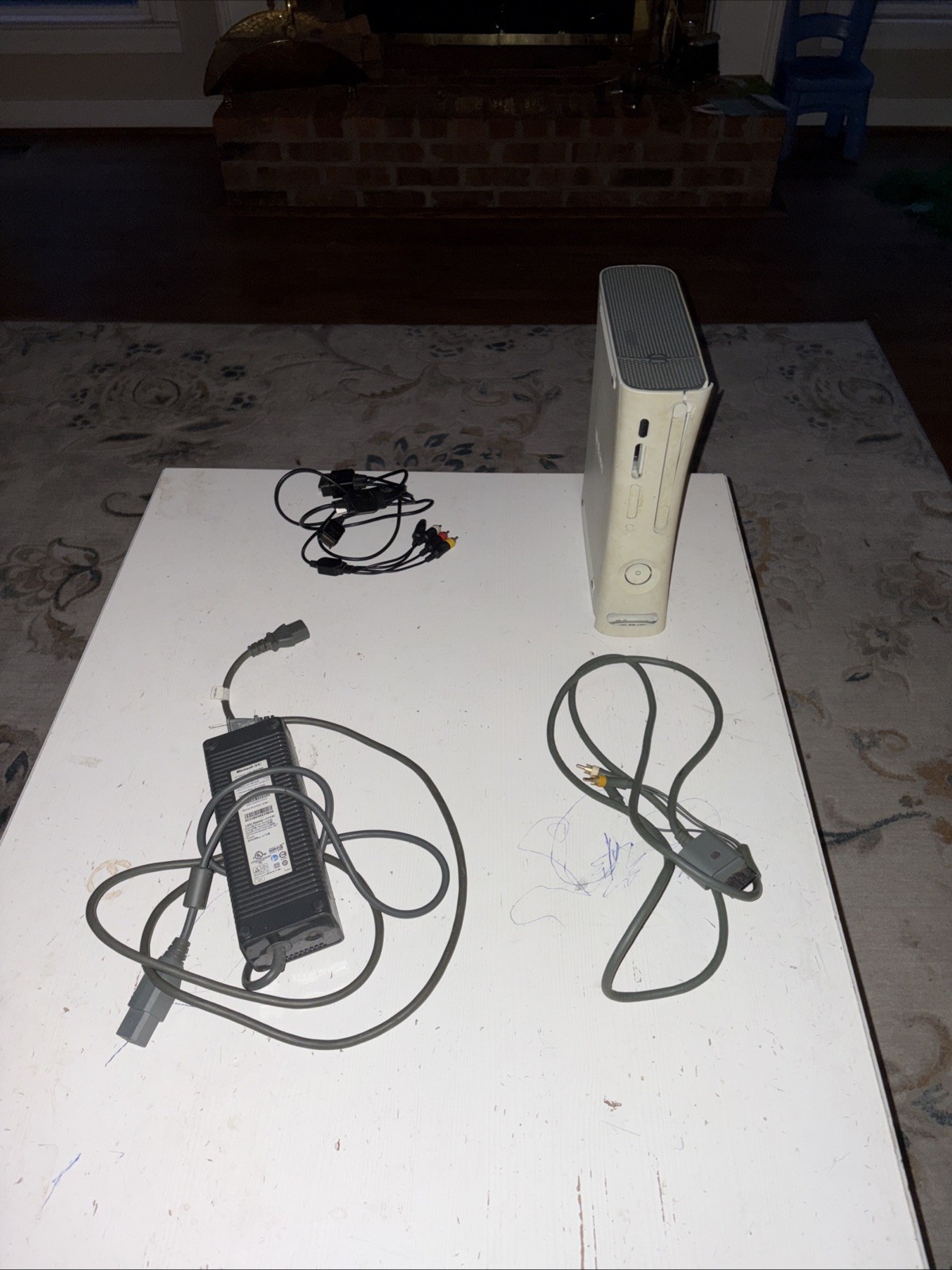 Xbox 360 With Cables Included. No Controller included Also, Not Sure If It Works
