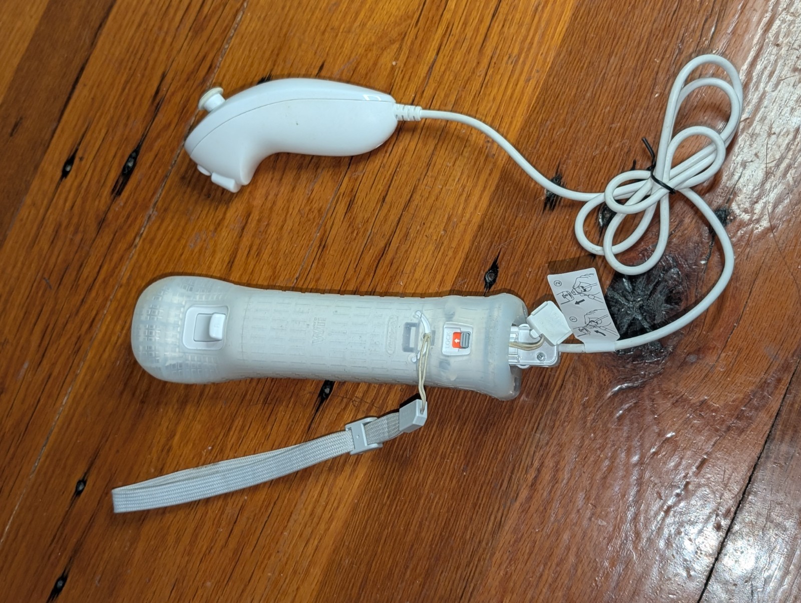 Nintendo Wii White Remote with Motion Plus Adapter and Sleeve and Nunchuck