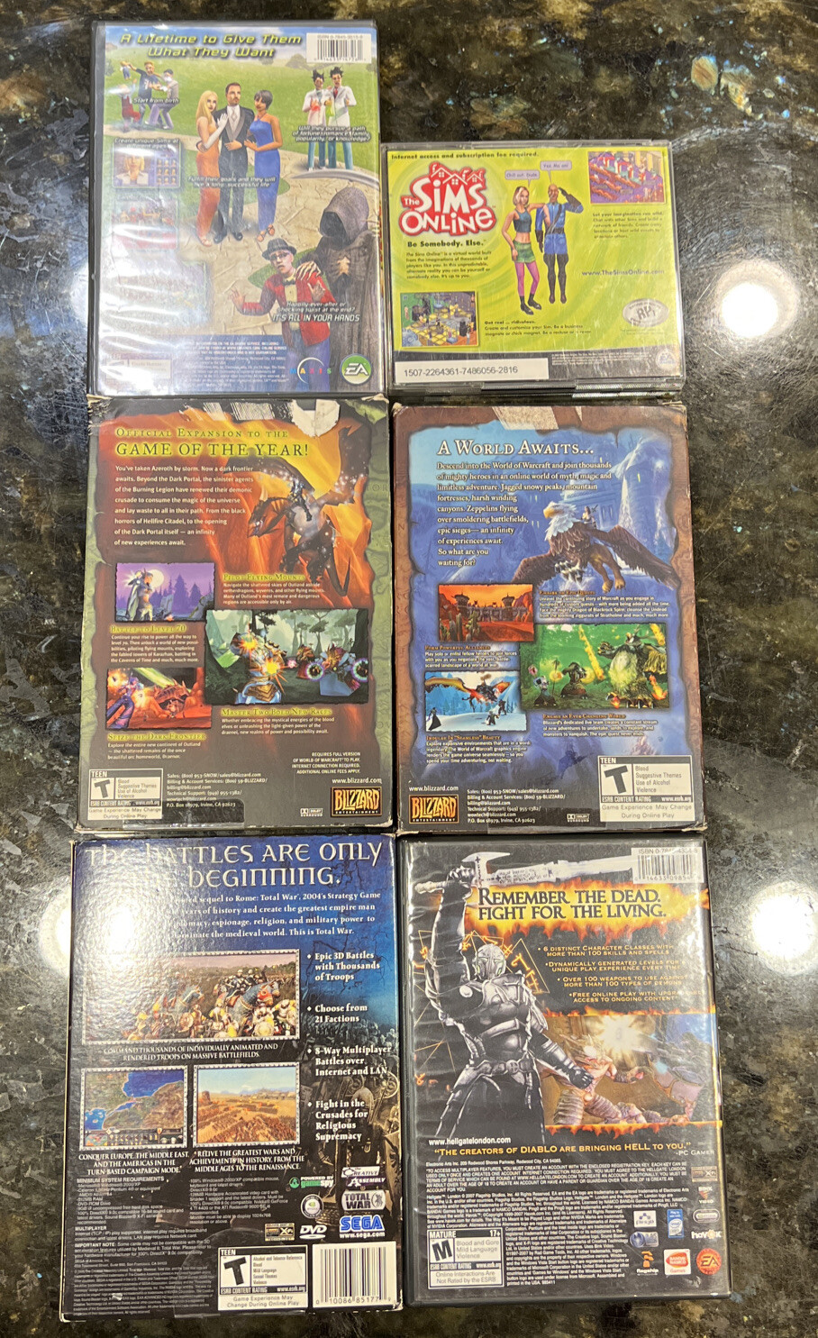 6 PC DVD-Rom Games Hellgate, Medieval II Total War, World Of WarCraft, Sims Lot