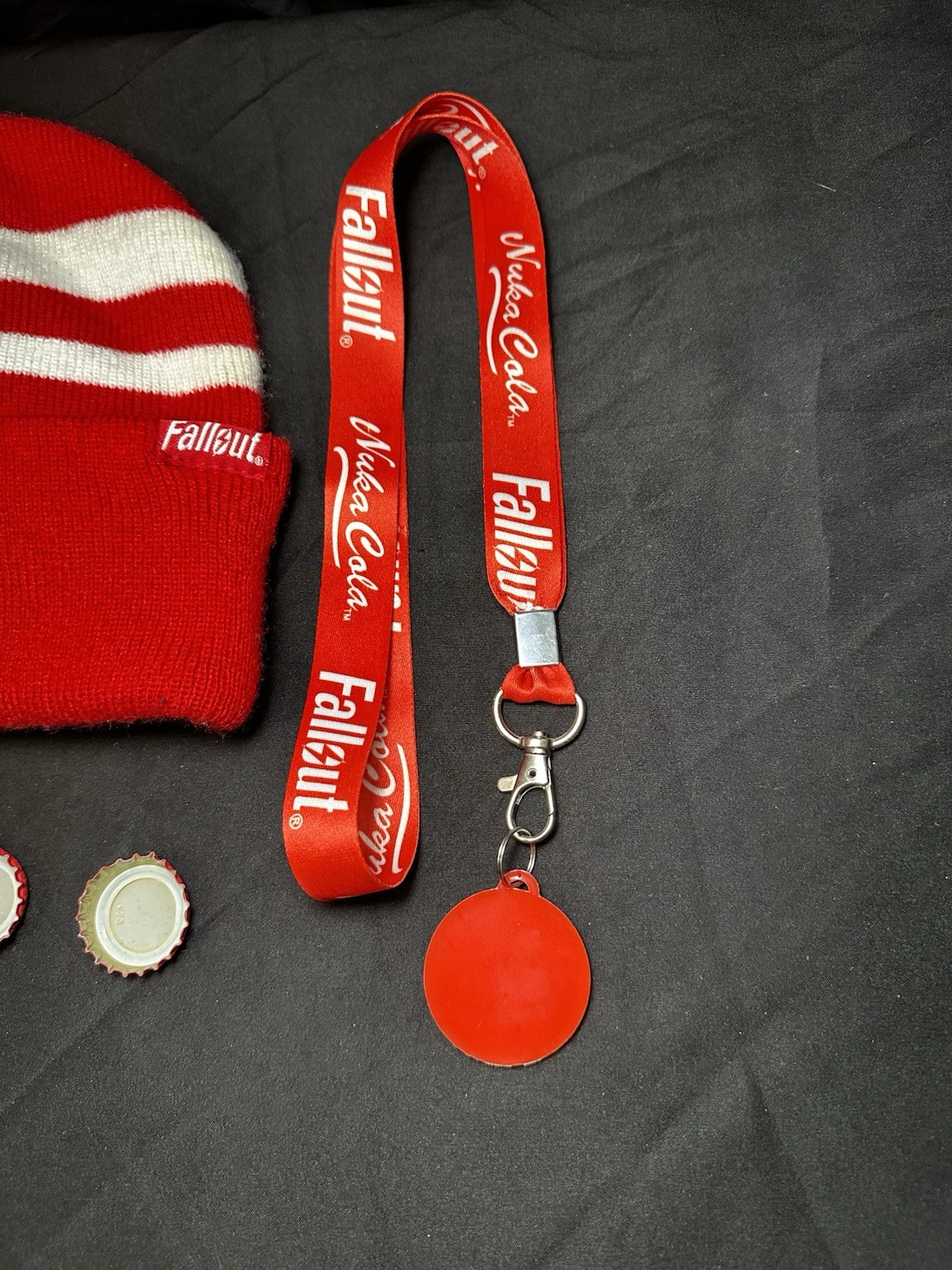 Lot of Bethesda Fallout Nuka Cola Bottle Caps, Beanie Hat, Lanyard & Keychain