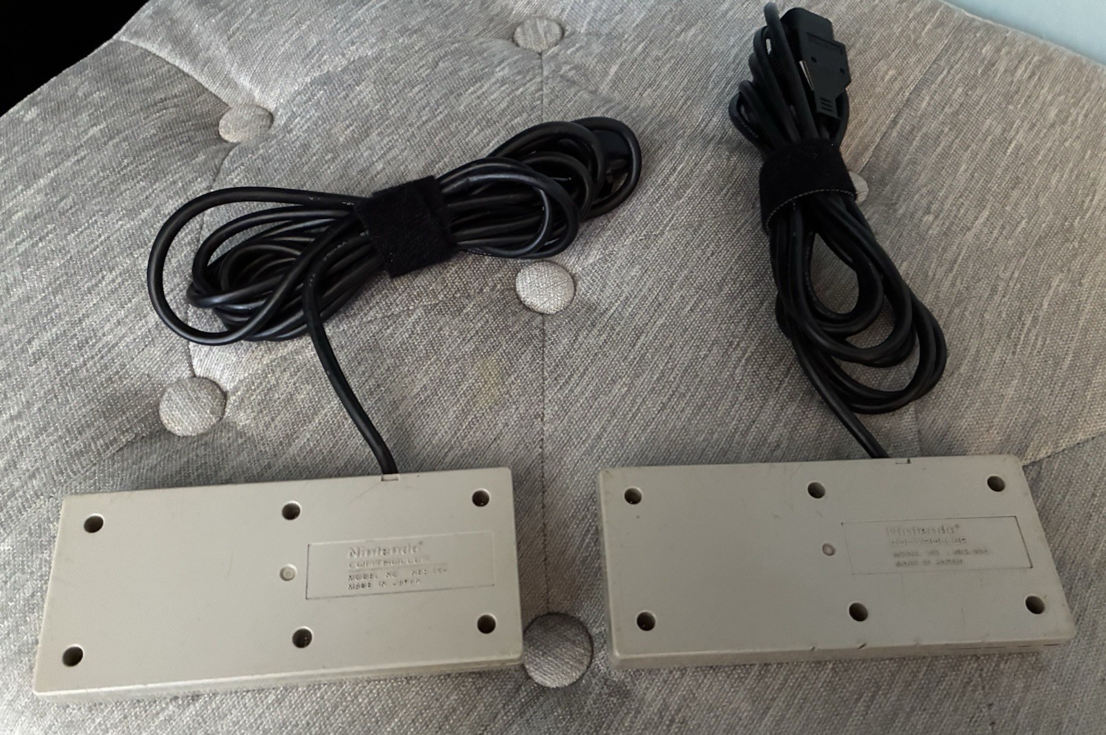 2 Vintage Nintendo NES OEM Controllers, RF Adapter, And Manual.