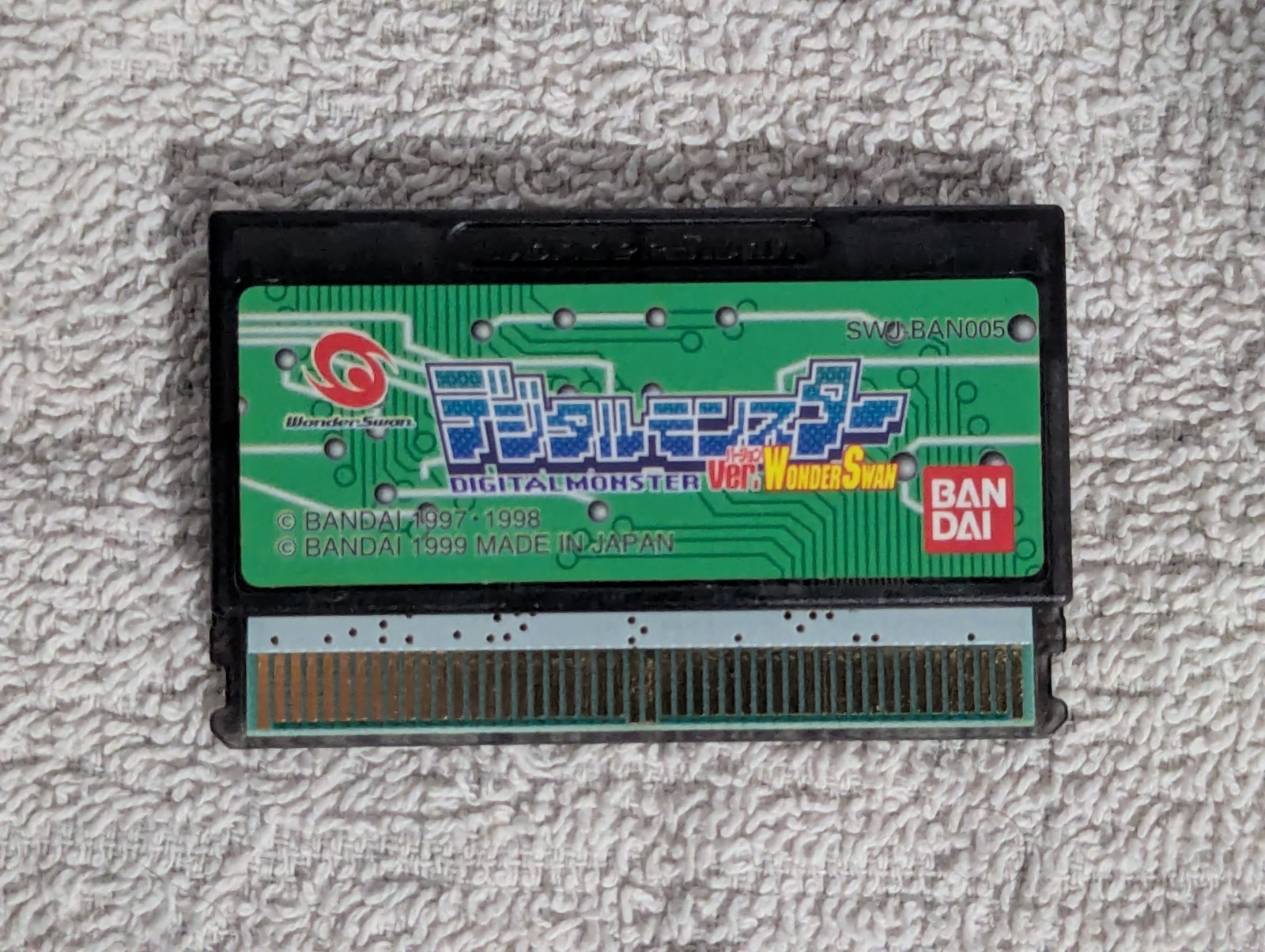 Bandai WonderSwan, Silver. With Digimon