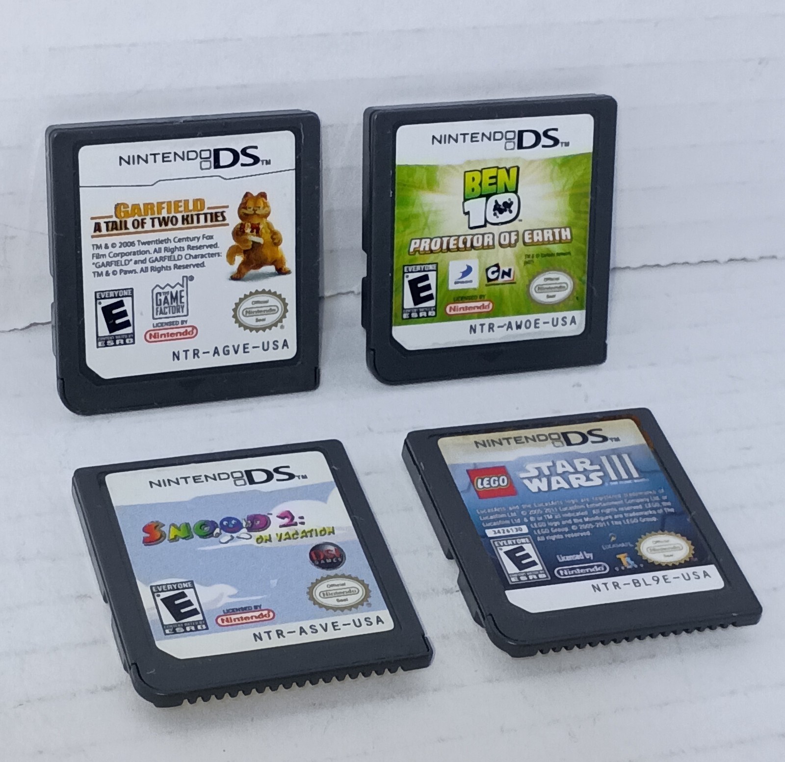 Nintendo DS Lot of 4 Ben 10 Garfield Snood 2 Star Wars CARTRIDGE Only Bundle