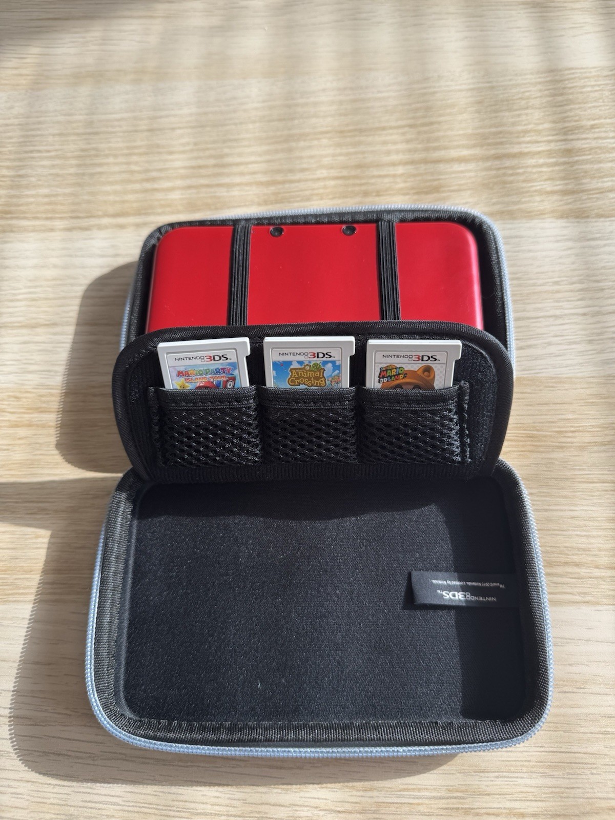 Nintendo 3DS XL Red/Black – Includes Stylus, Case + 3 Games