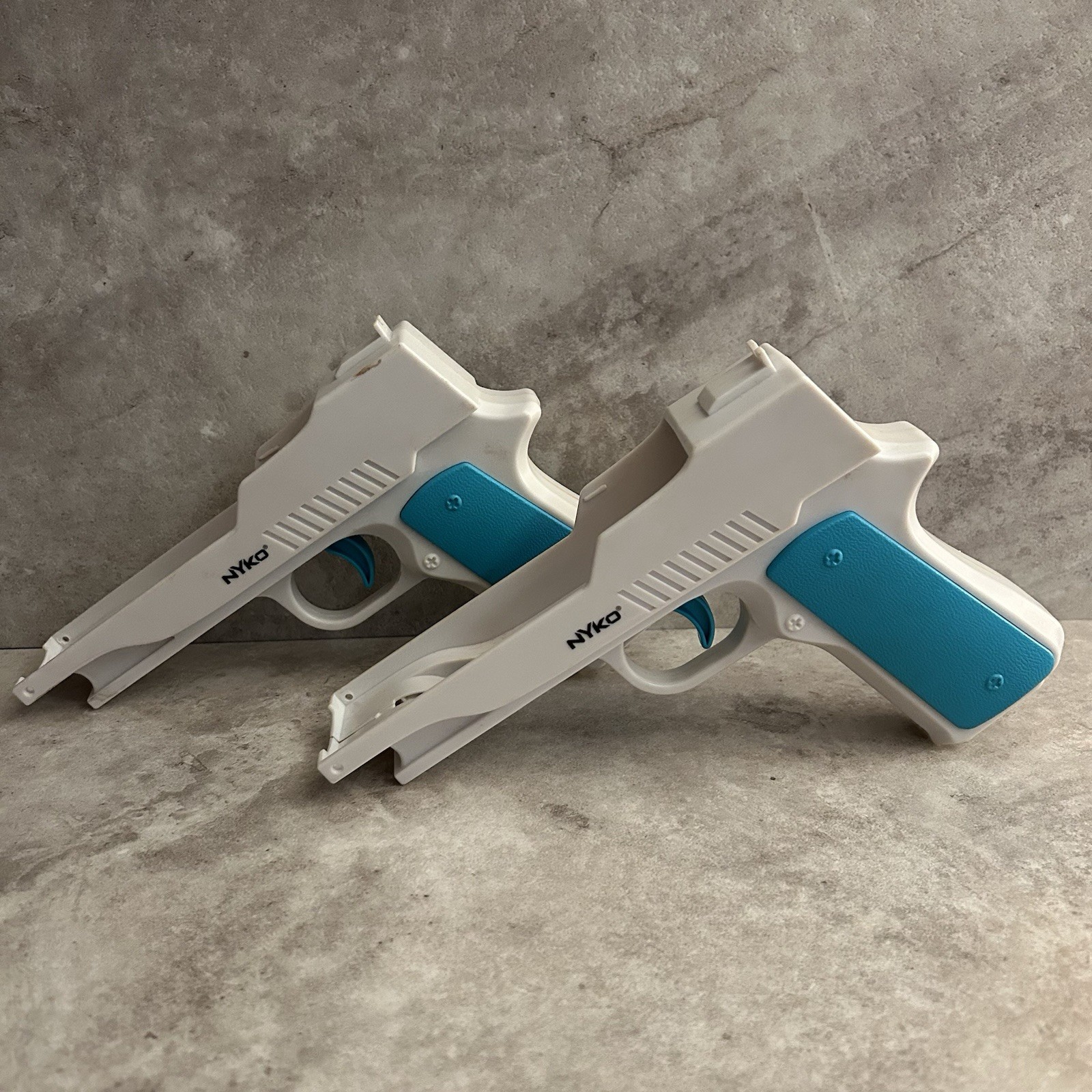 Nyko Perfect Shot Gun Controller White Blue Orange for Nintendo Wii Remote Pair