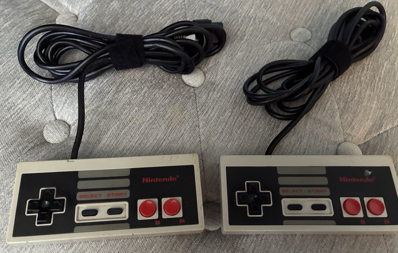 2 Vintage Nintendo NES OEM Controllers, RF Adapter, And Manual.