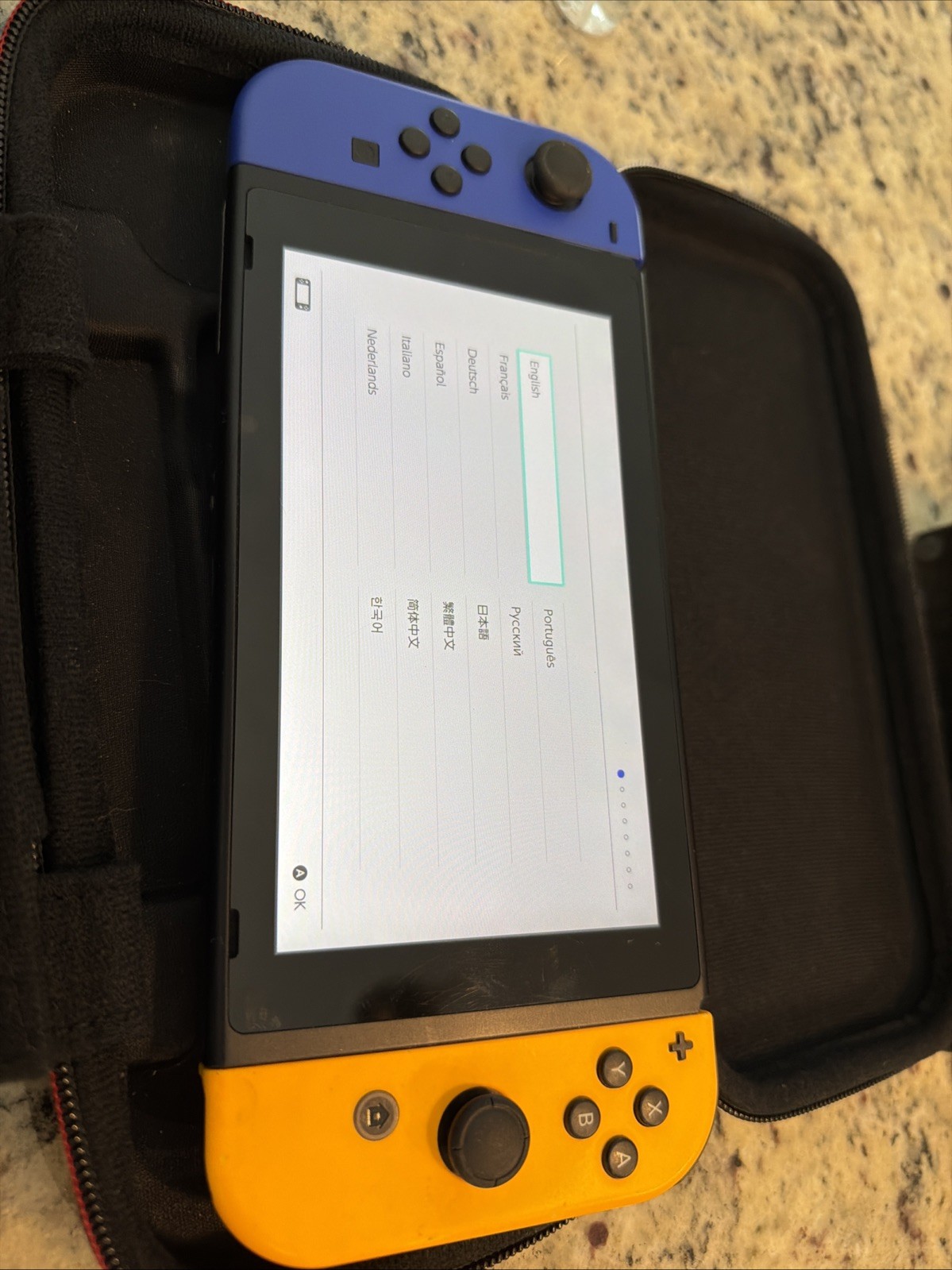 Nintendo Switch Gray Console with Orange and Neon Blue Joy-Con Charger Dock Case