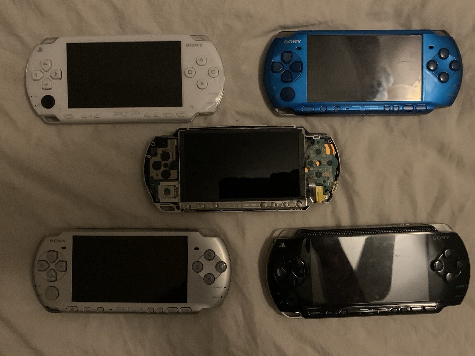 Sony PSP Handheld System Lot of 3 (White/Silver/Blue) and 2 PSP for parts/repair