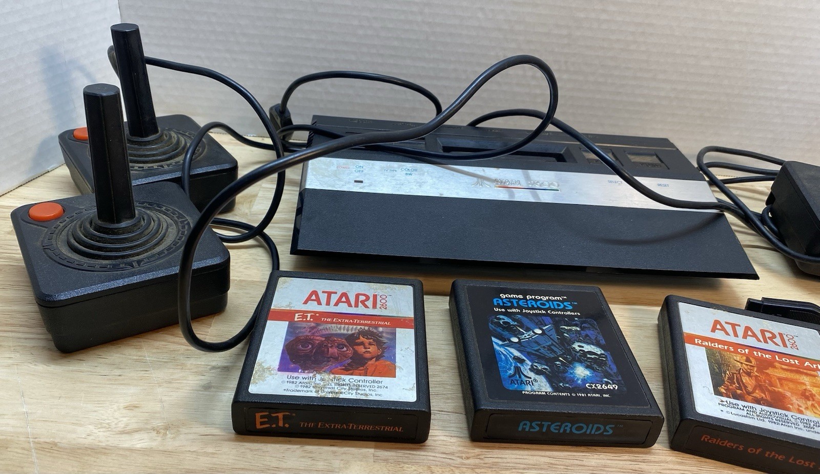 Atari 2600 Console with Games Asteroids ET Raiders of the Lost Ark