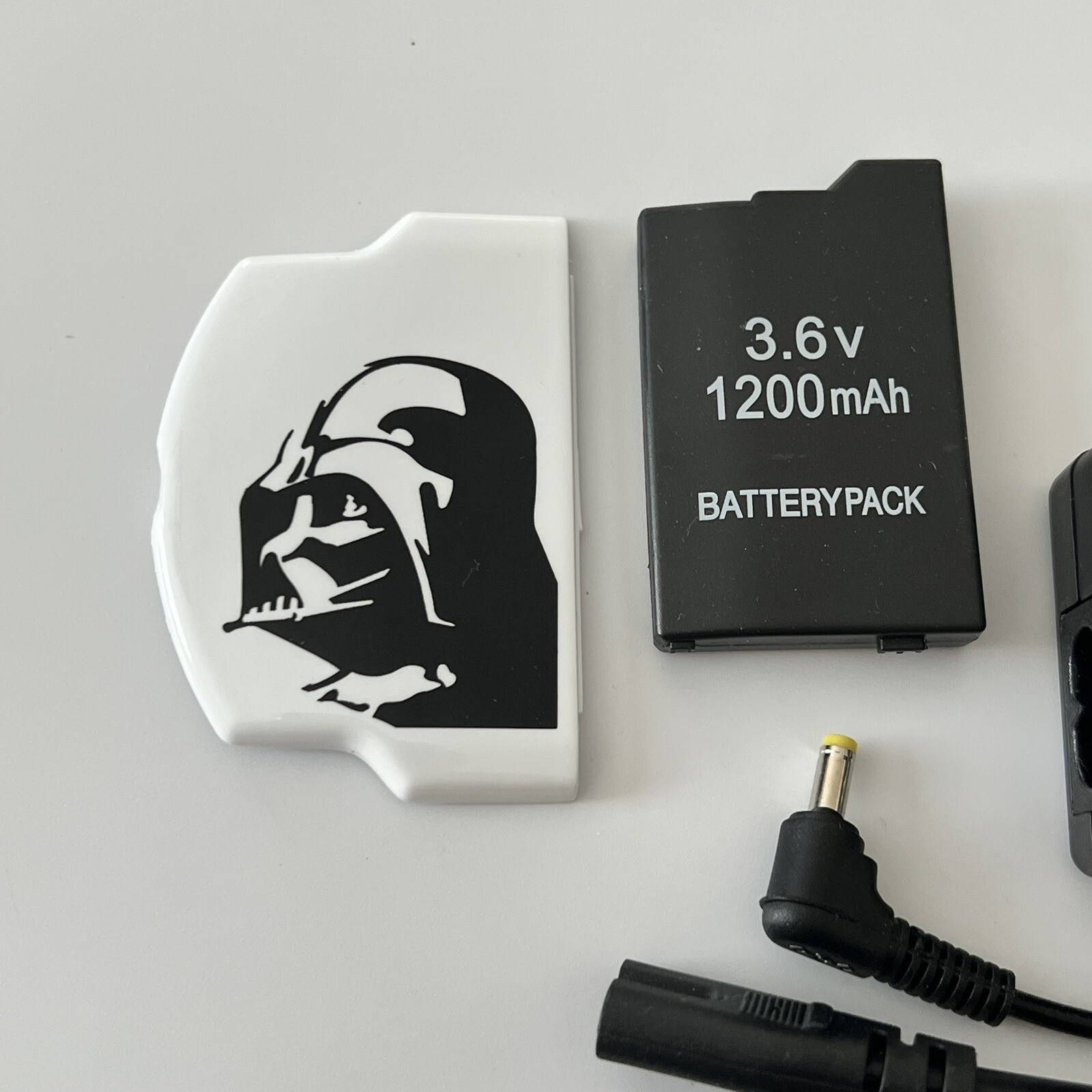 QUALITY PSP 2000 Kit – Battery, Charger, Star Wars Cover, 8gb Memory Card