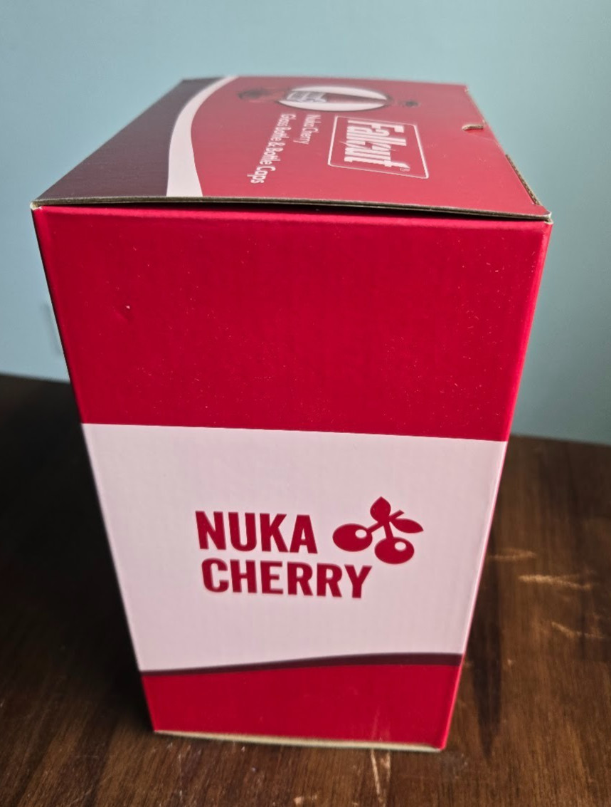 Fallout Nuka Cola Cherry Glass Rocket Bottle & 10 Bottle Caps NEW