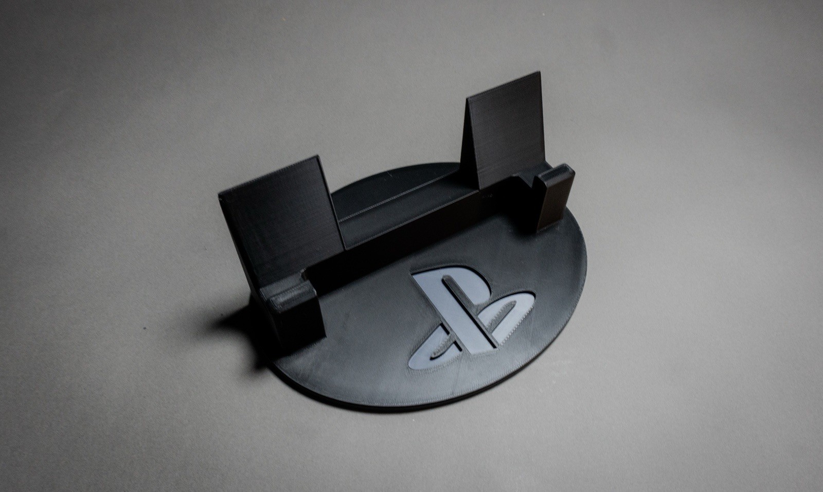Sony PlayStation Portal Display Stand with Classic PS Logo Black and Gray.