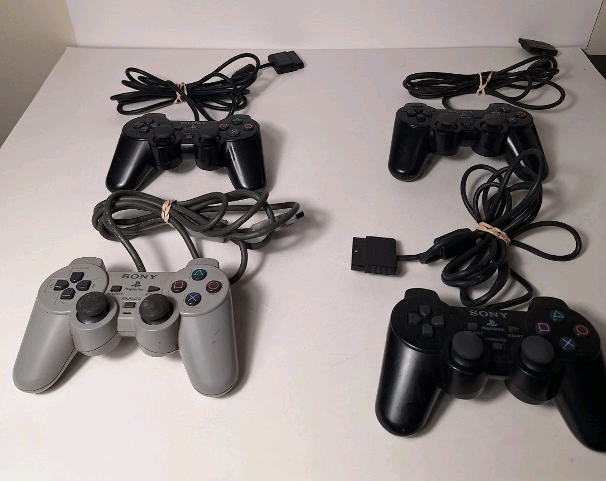 Sony PS1 PS2 Controllers Lot Of 4 Wired Black And Gray UNTESTED Parts Or Repair