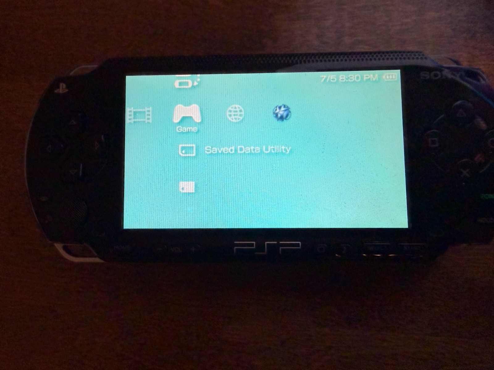 Sony PSP-1001 Black Handheld Console Wi-Fi, USB Cable & UMD Games Bundle