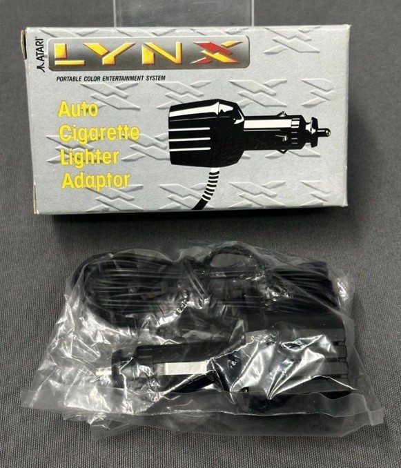 Atari Lynx Cigarette Lighter Adaptor Model PAG 3300 Vintage New Opened Box