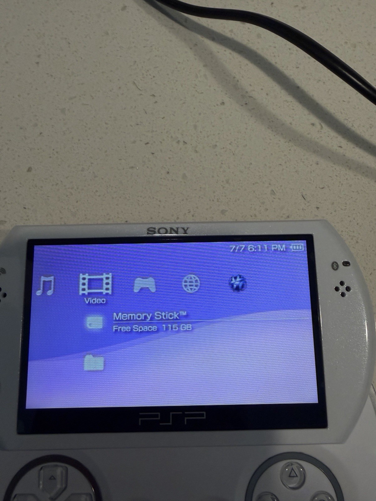 Sony PSP Go White/Silver 16GB Wi-Fi Region Free Handheld w/ AC Adapter