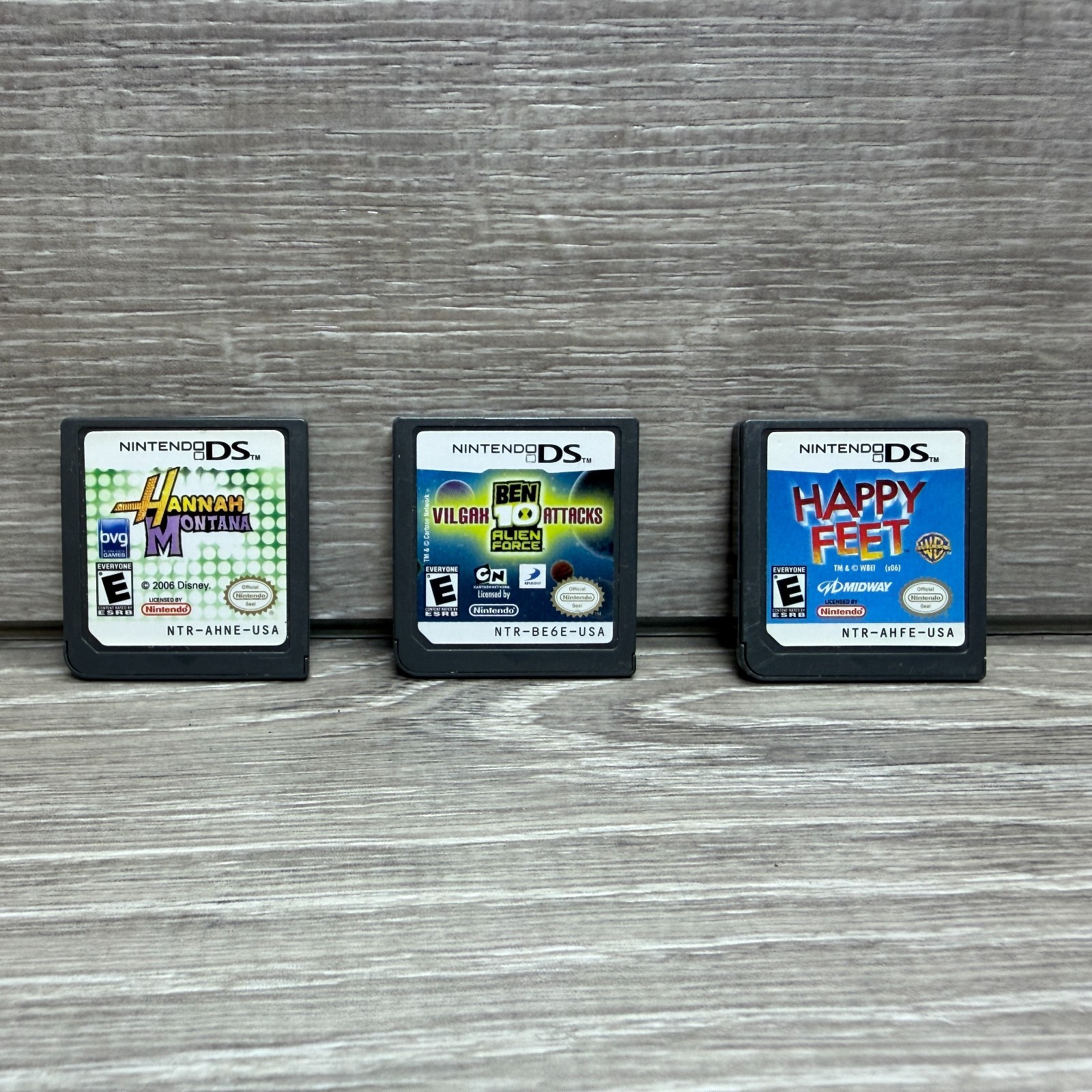 Nintendo DS Video Game Lot of 3 Kids Boys Girls Hannah Montana Ben 10 Happy Feet