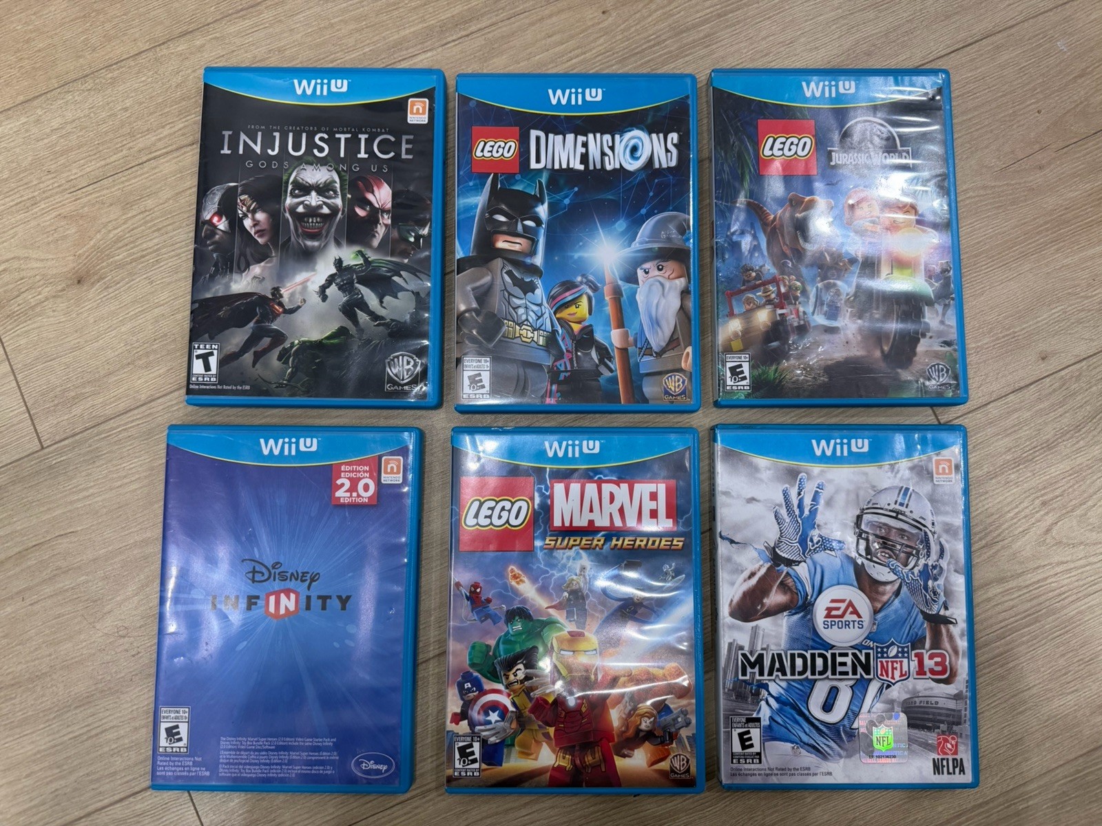 Wii U Bundle Of 6 Video Games: Injustice, Dimensions, Jurassic Park, Super H Etc
