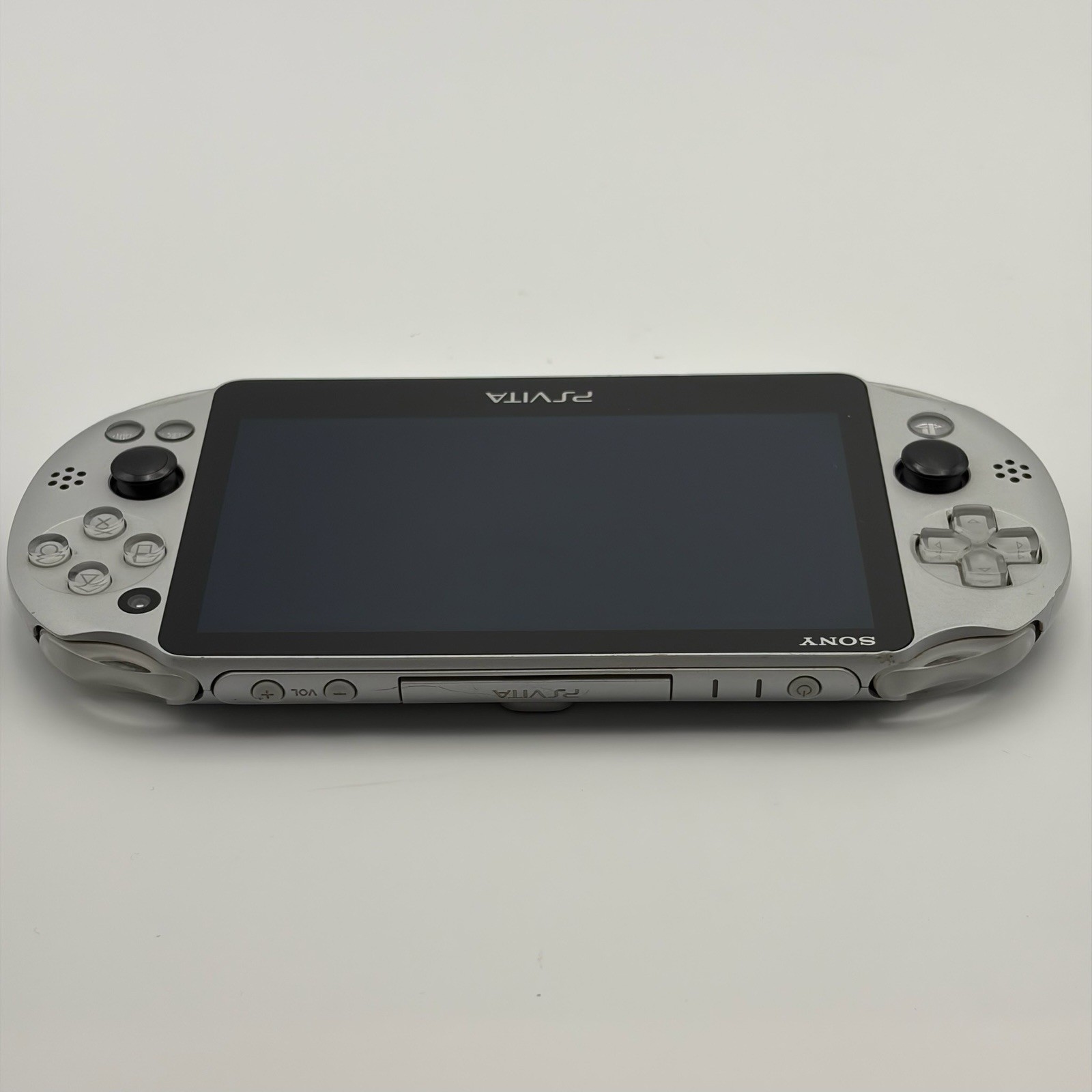 SONY PS Vita PCH-2000 Console Silver Very Good Fast Shipping No joystick drift.