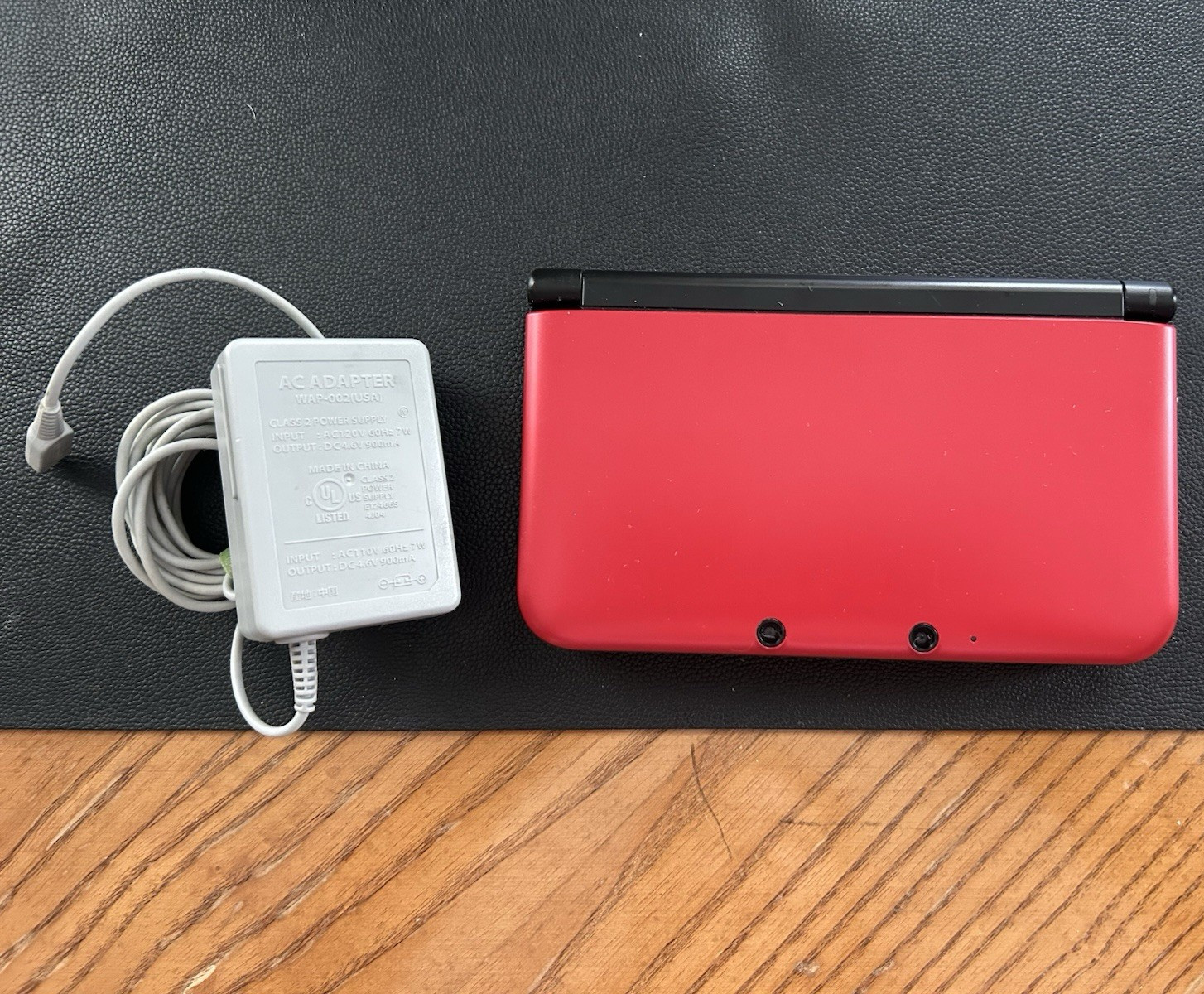 Nintendo 3DS XL Red/Black Console w/ AC Adapter + Pokémon Sun Game NTSC-U/C