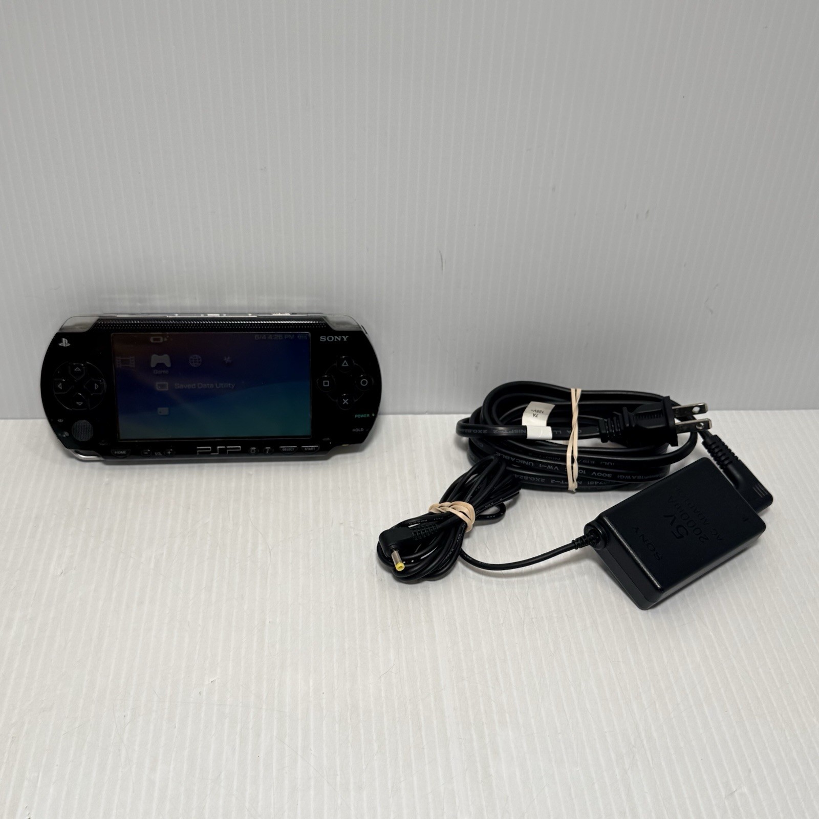 Sony PSP-1001 Black Console With Charger And 32 MB Sony Storage Memory Card