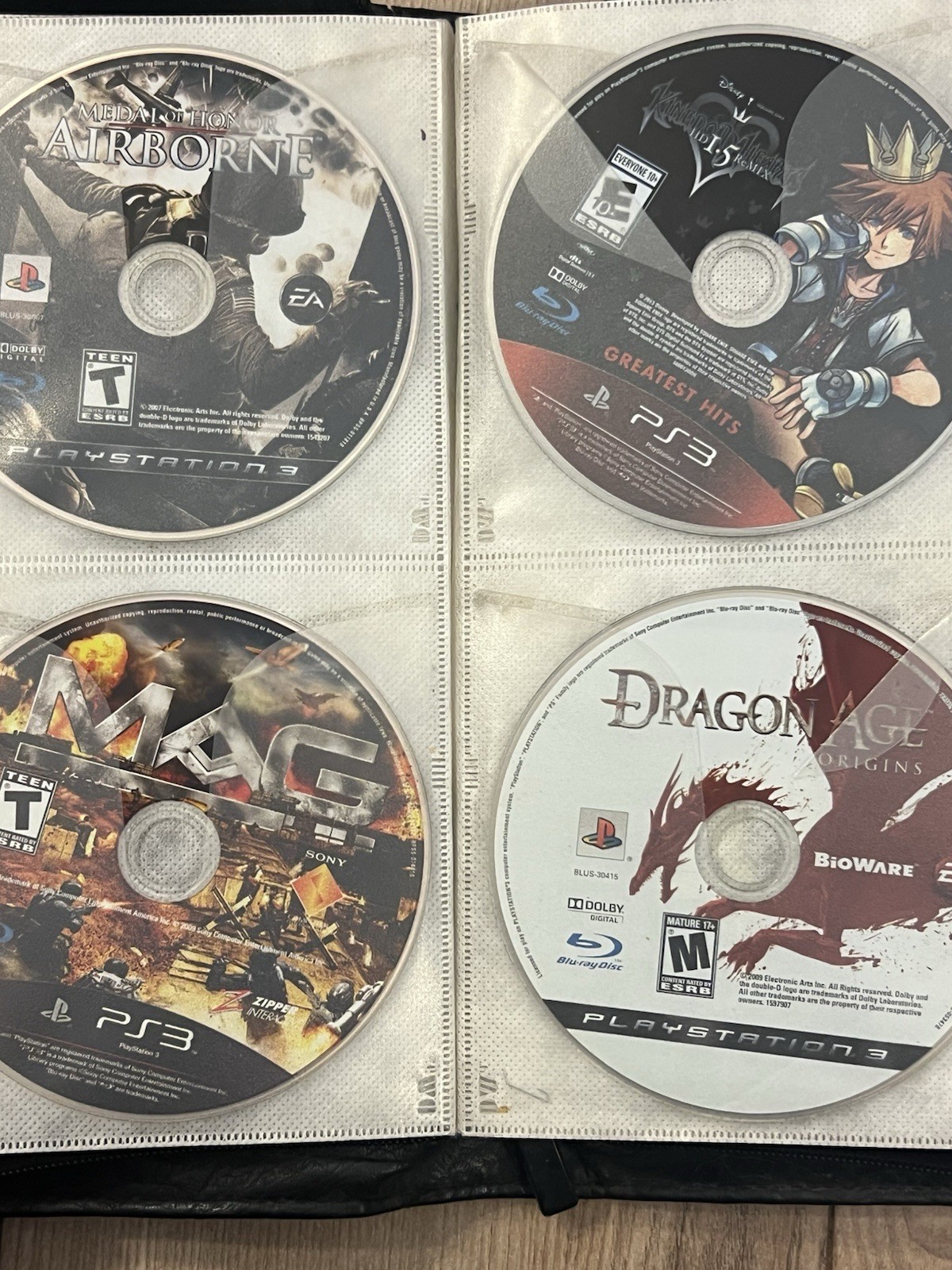 Lot Of 64 Sony Playstation 3 PS3 Disc Only Games Binder Untested Mixed Games