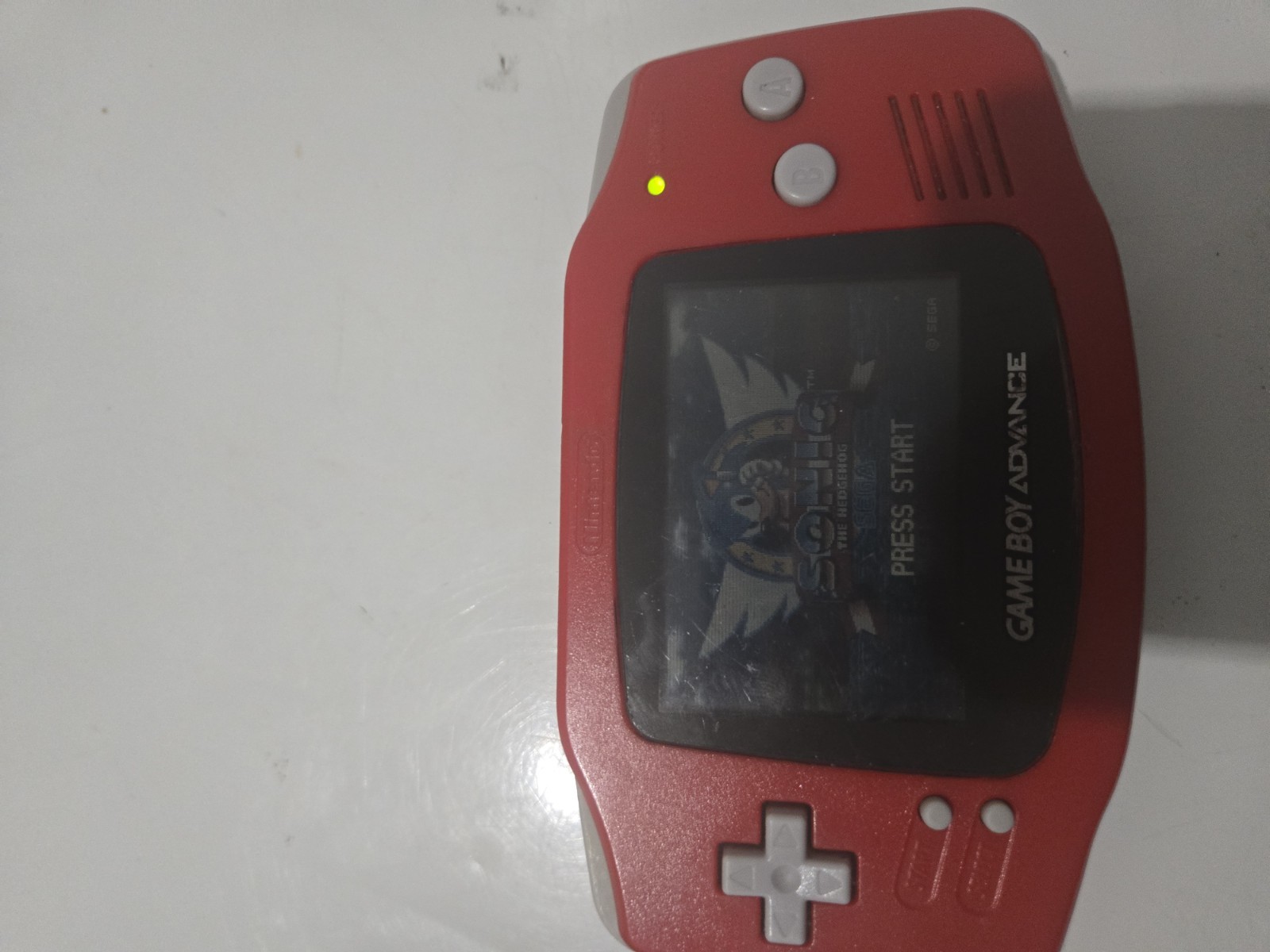 red gameboy advance with 2 games and case tested