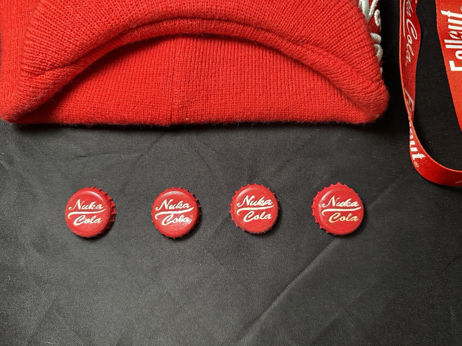 Lot of Bethesda Fallout Nuka Cola Bottle Caps, Beanie Hat, Lanyard & Keychain
