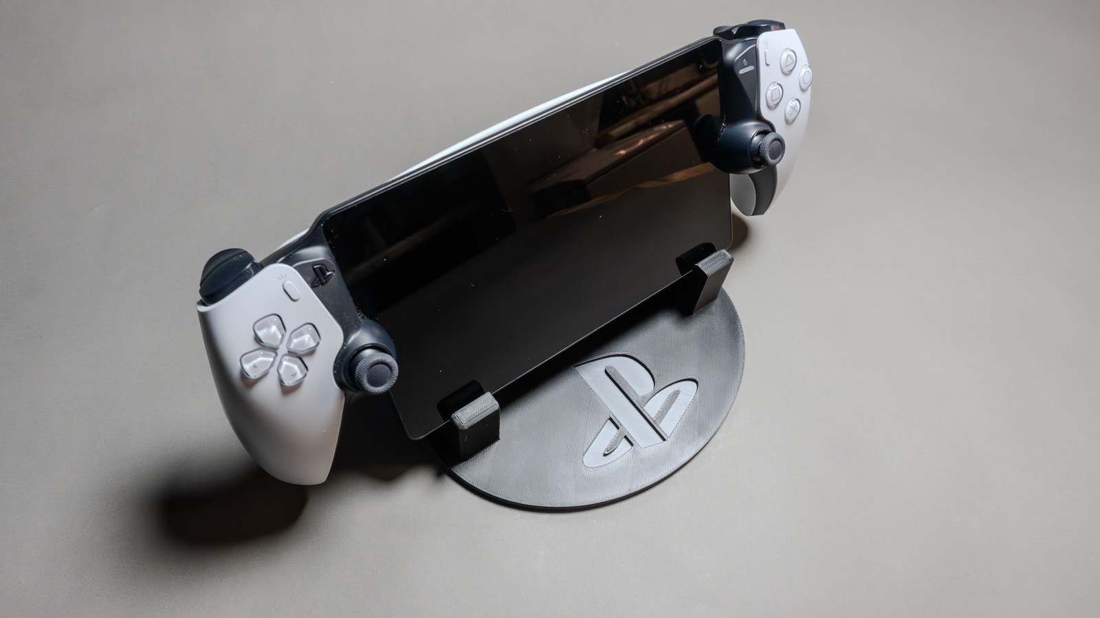 Sony PlayStation Portal Display Stand with Classic PS Logo Black and Gray.