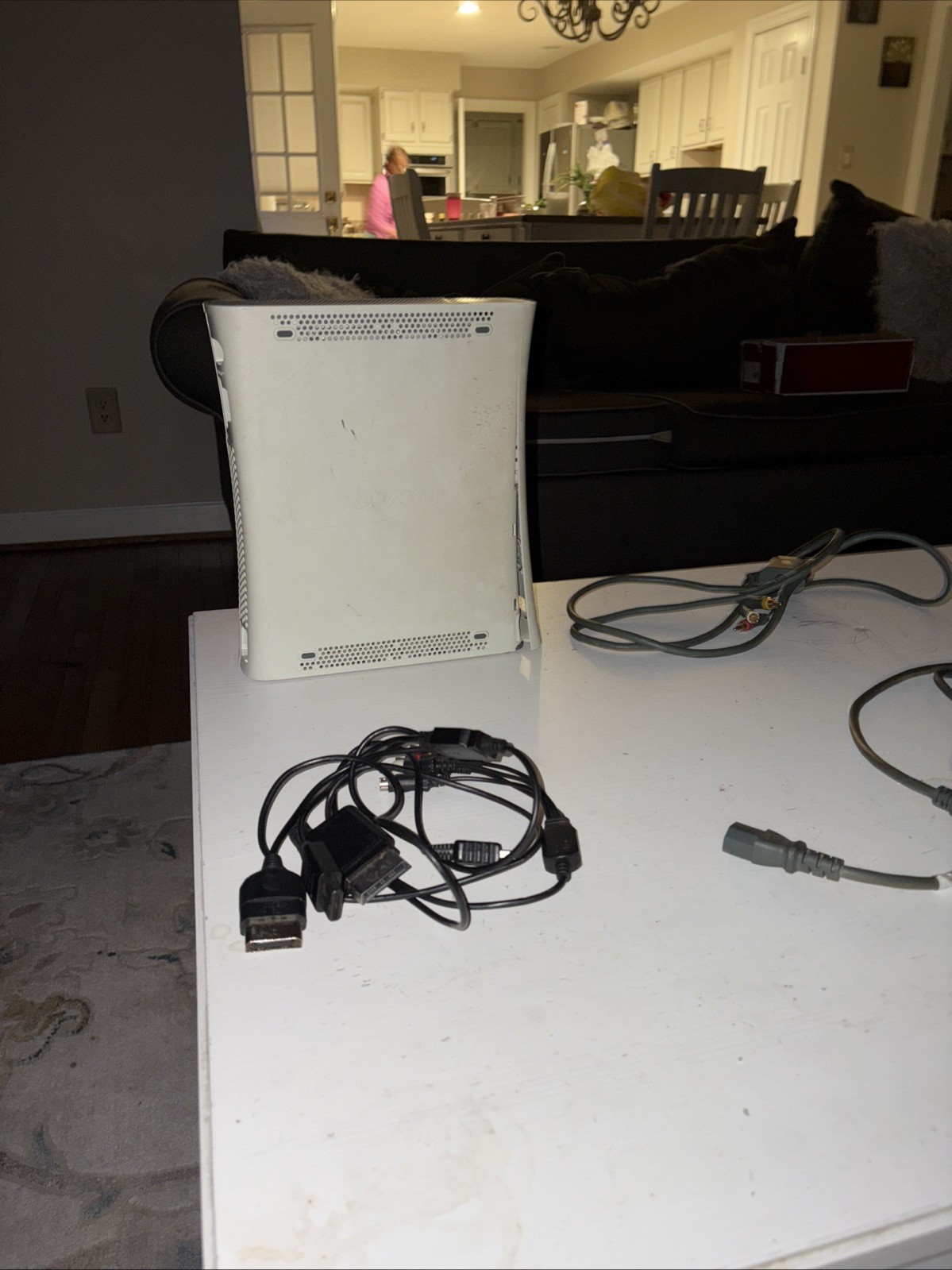Xbox 360 With Cables Included. No Controller included Also, Not Sure If It Works